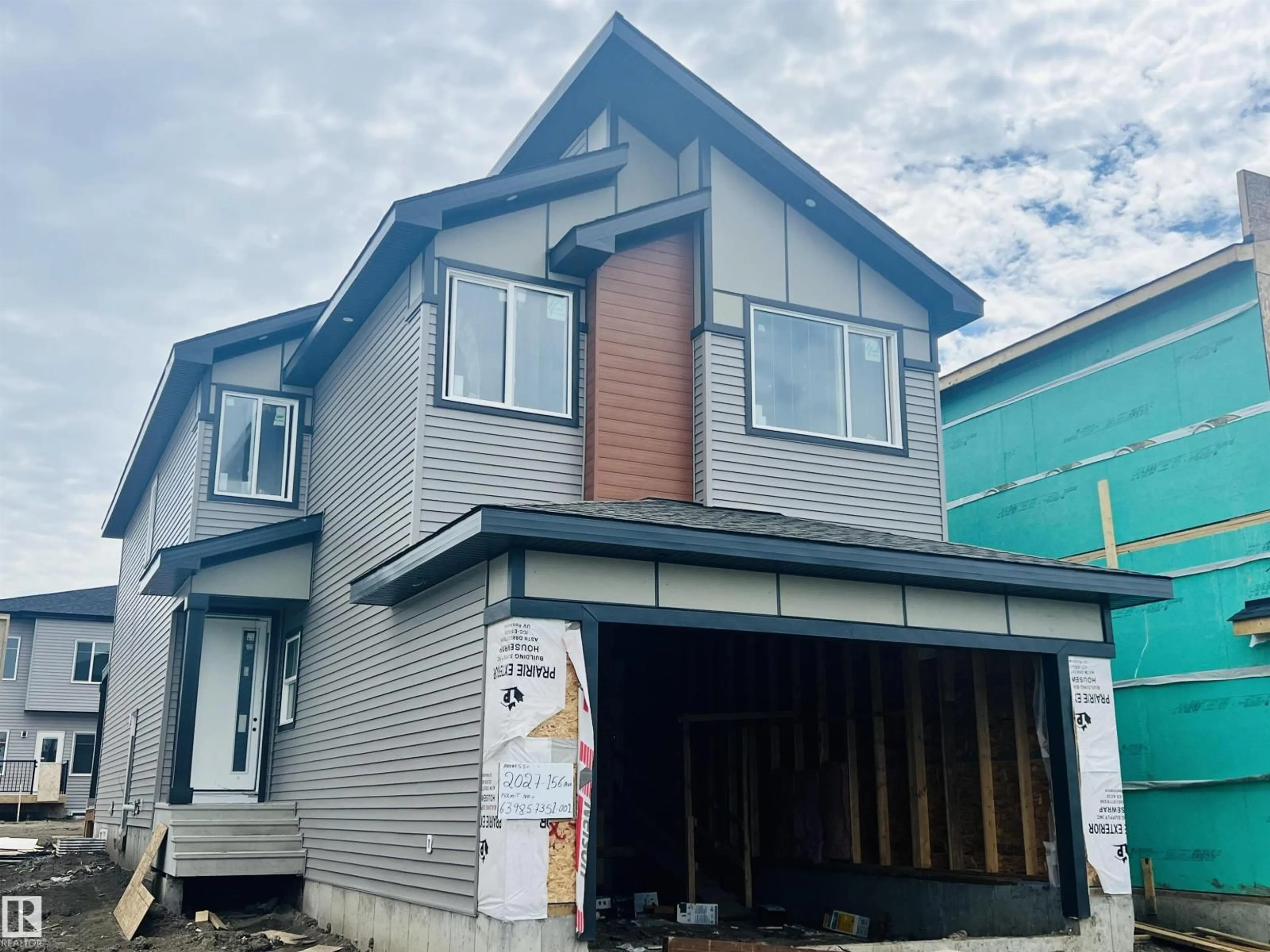 Home with vinyl exterior material, building for 2027 156 AV, Edmonton Alberta T5Y4N3