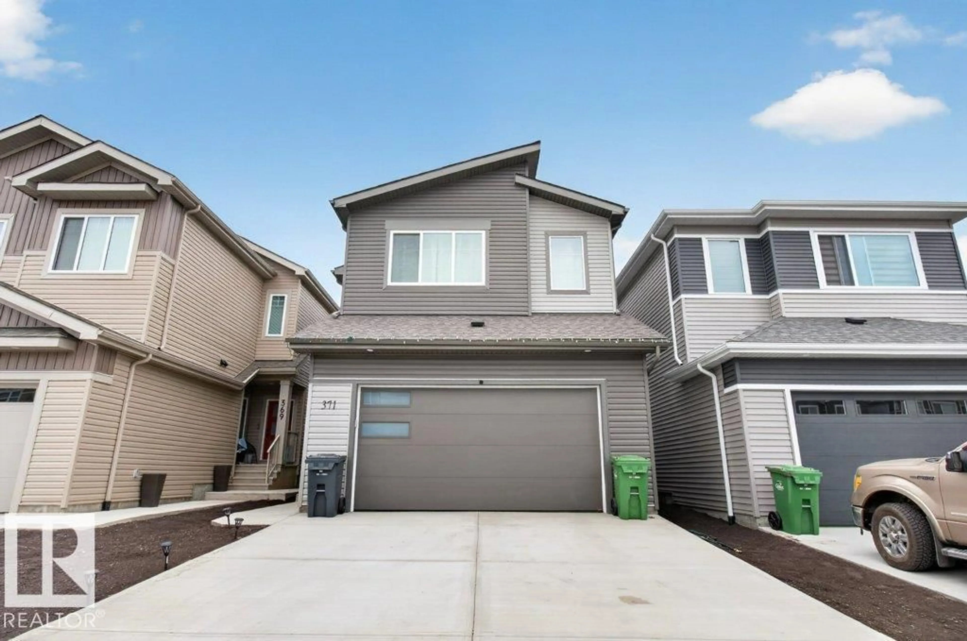 Home with vinyl exterior material, street for 371 BLUFF CV, Leduc Alberta T9E1M9