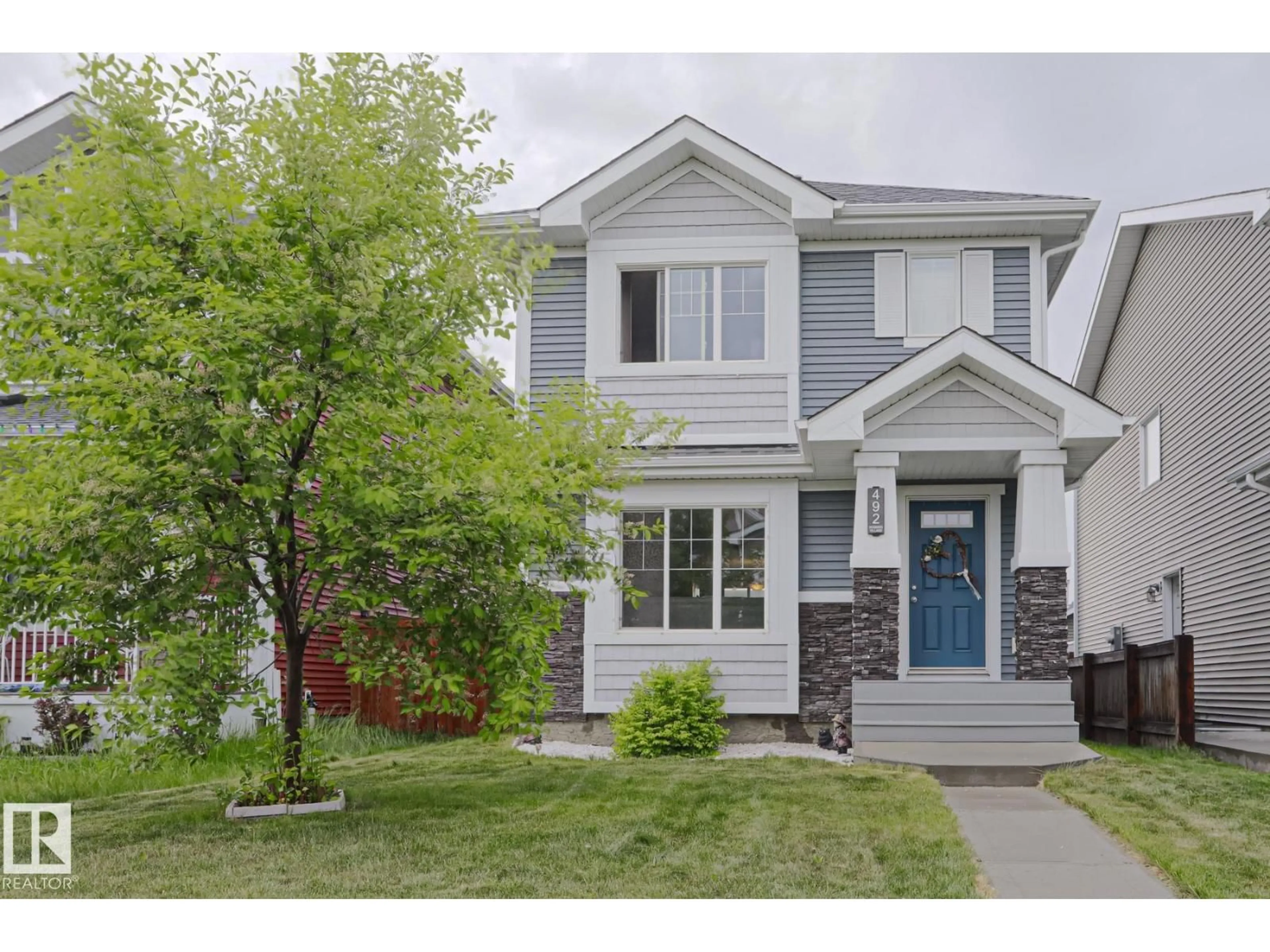 Home with vinyl exterior material, street for 492 EBBERS WY, Edmonton Alberta T5Y3T7
