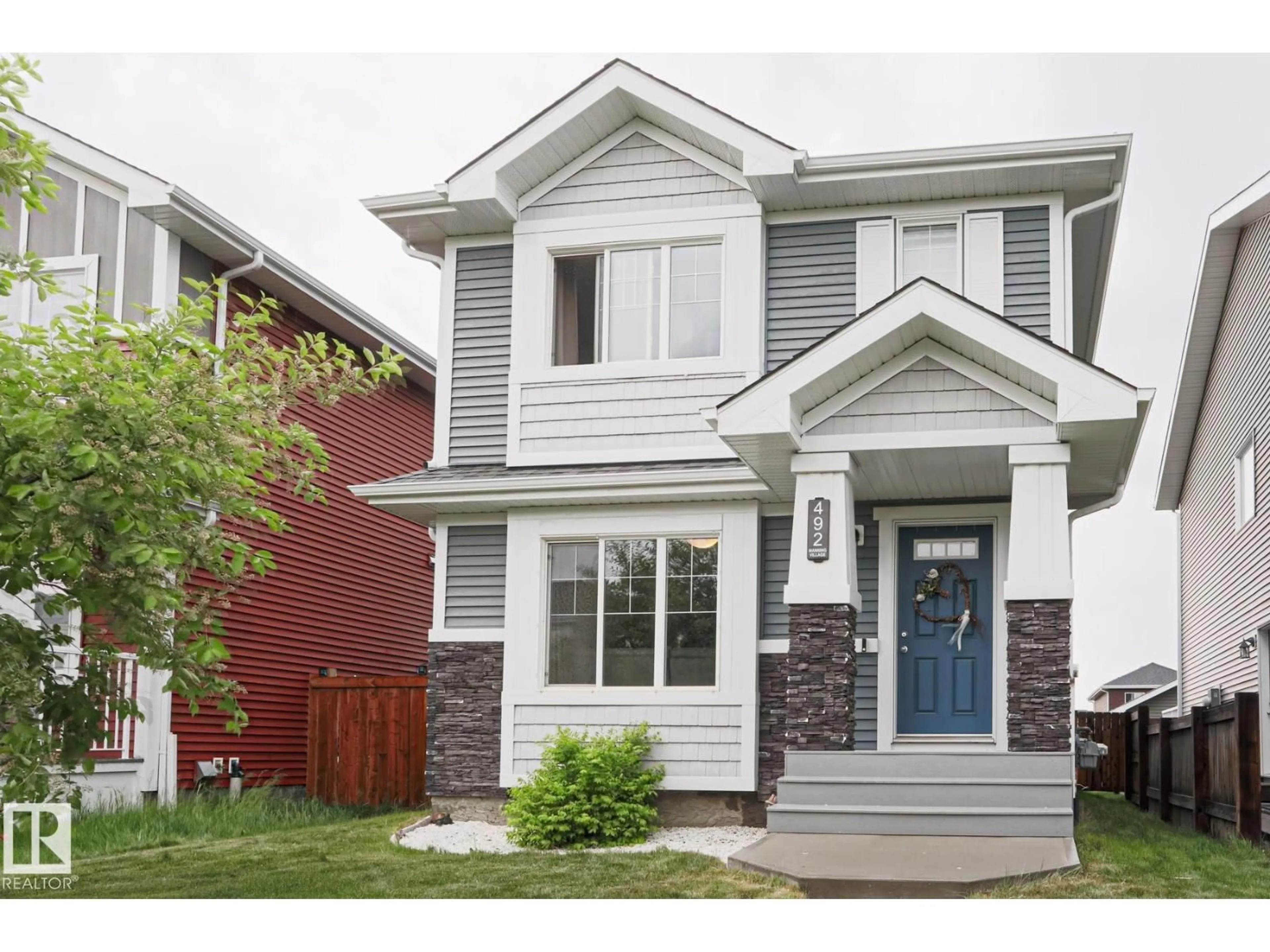 Home with vinyl exterior material, street for 492 EBBERS WY, Edmonton Alberta T5Y3T7