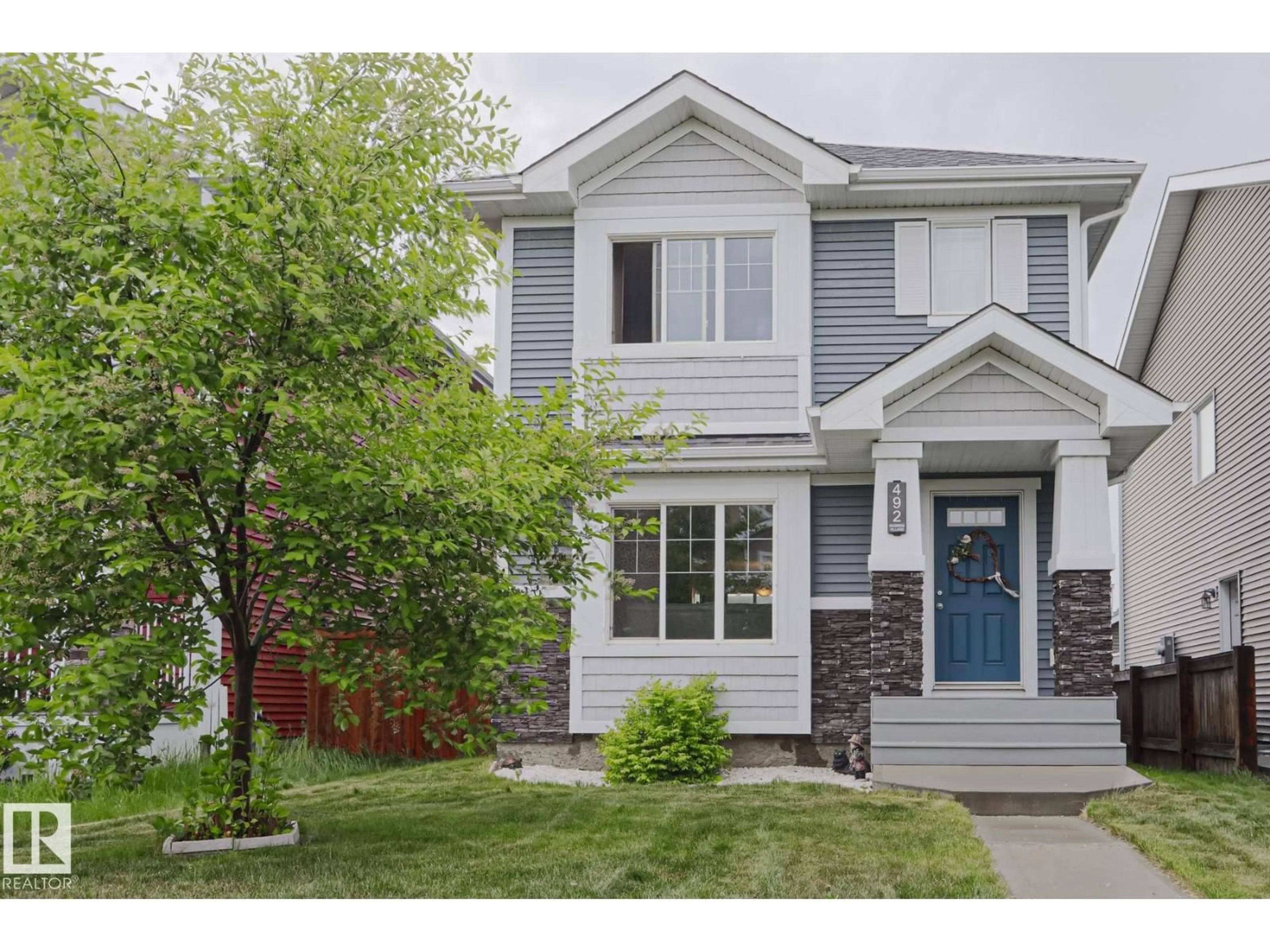 Home with vinyl exterior material, street for 492 EBBERS WY, Edmonton Alberta T5Y3T7