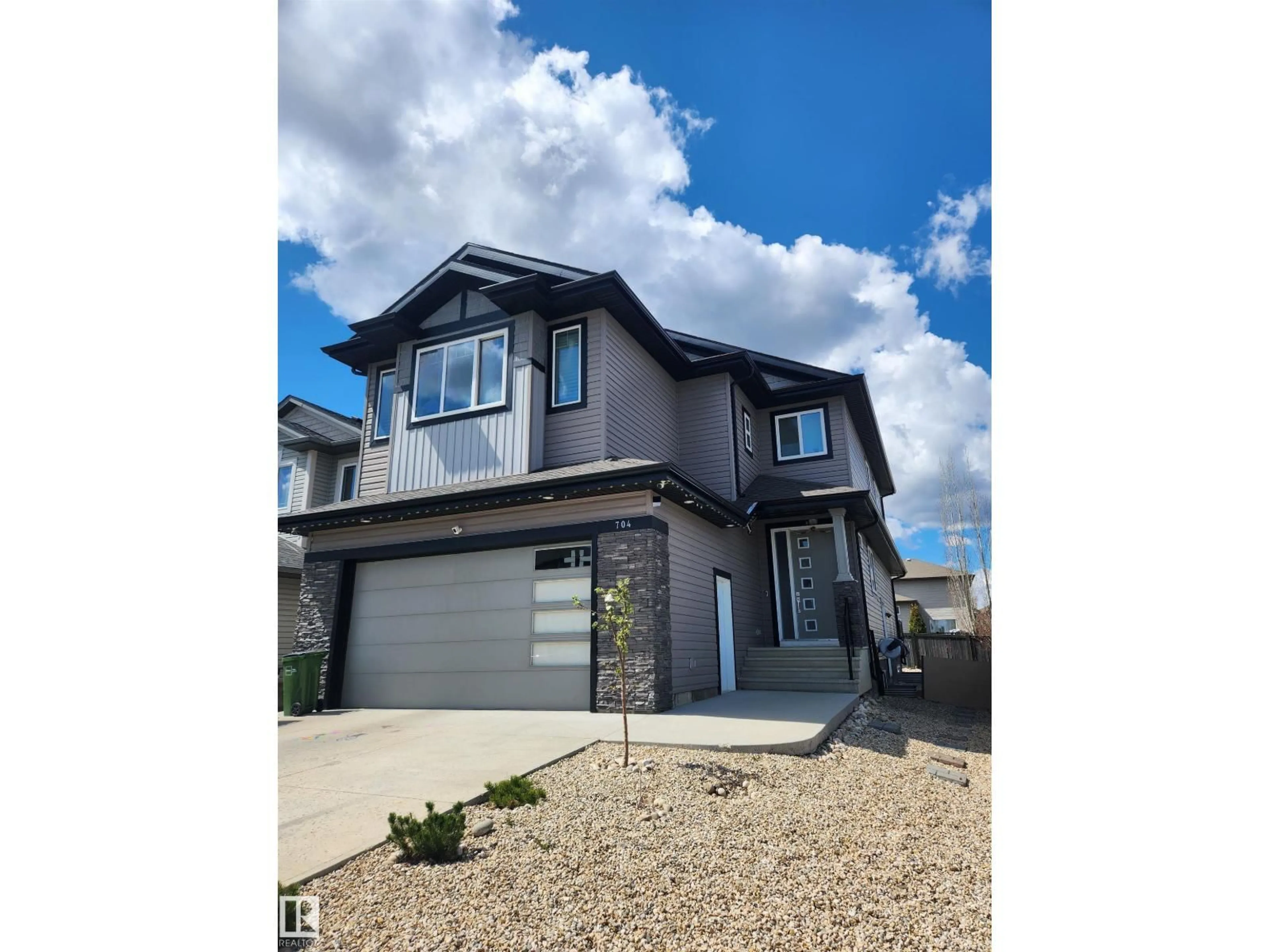 Home with vinyl exterior material, street for SW - 704 172 ST, Edmonton Alberta T6W0M5