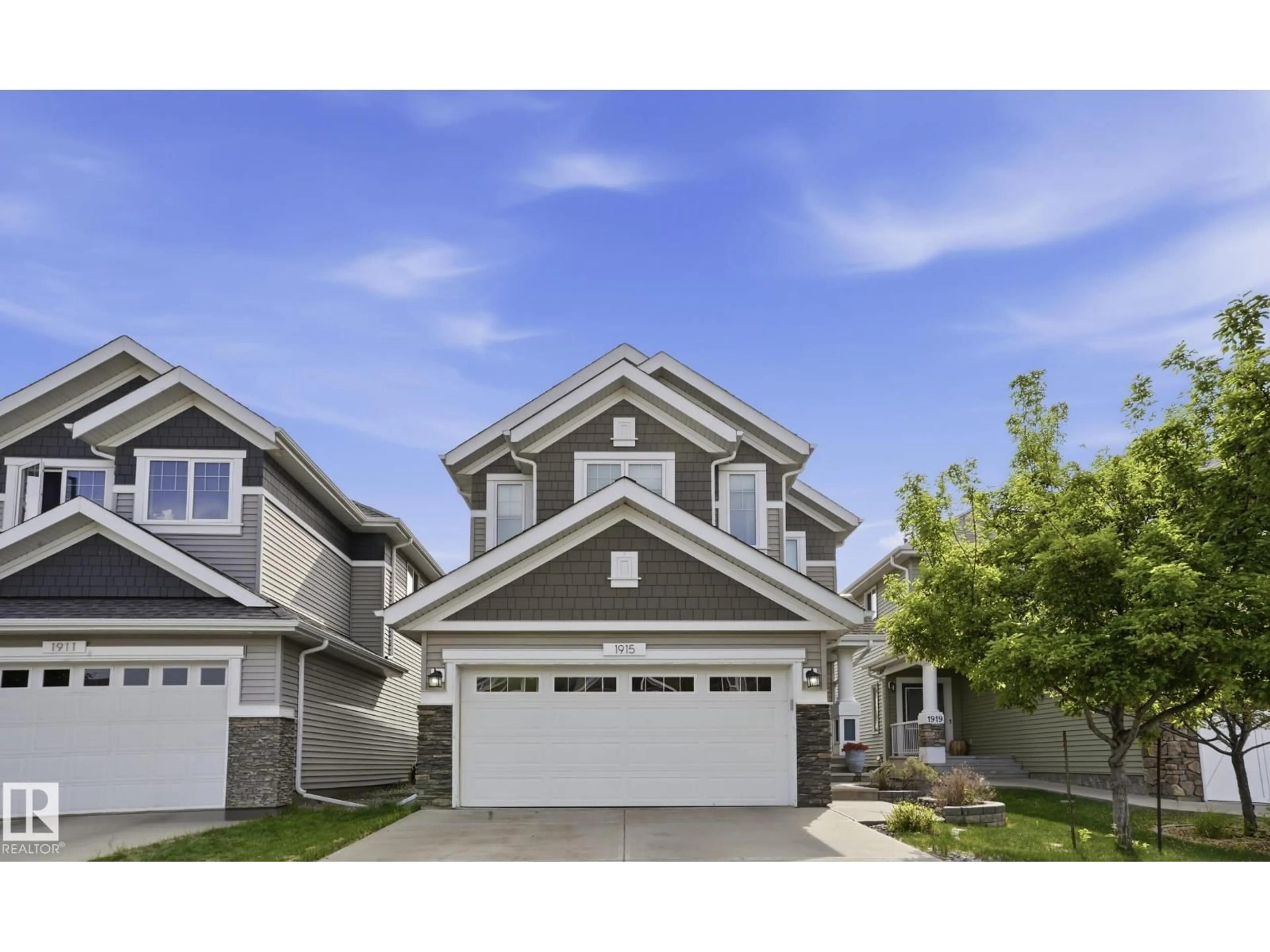 Home with vinyl exterior material, street for SW - 1915 77 ST, Edmonton Alberta T6X1V9