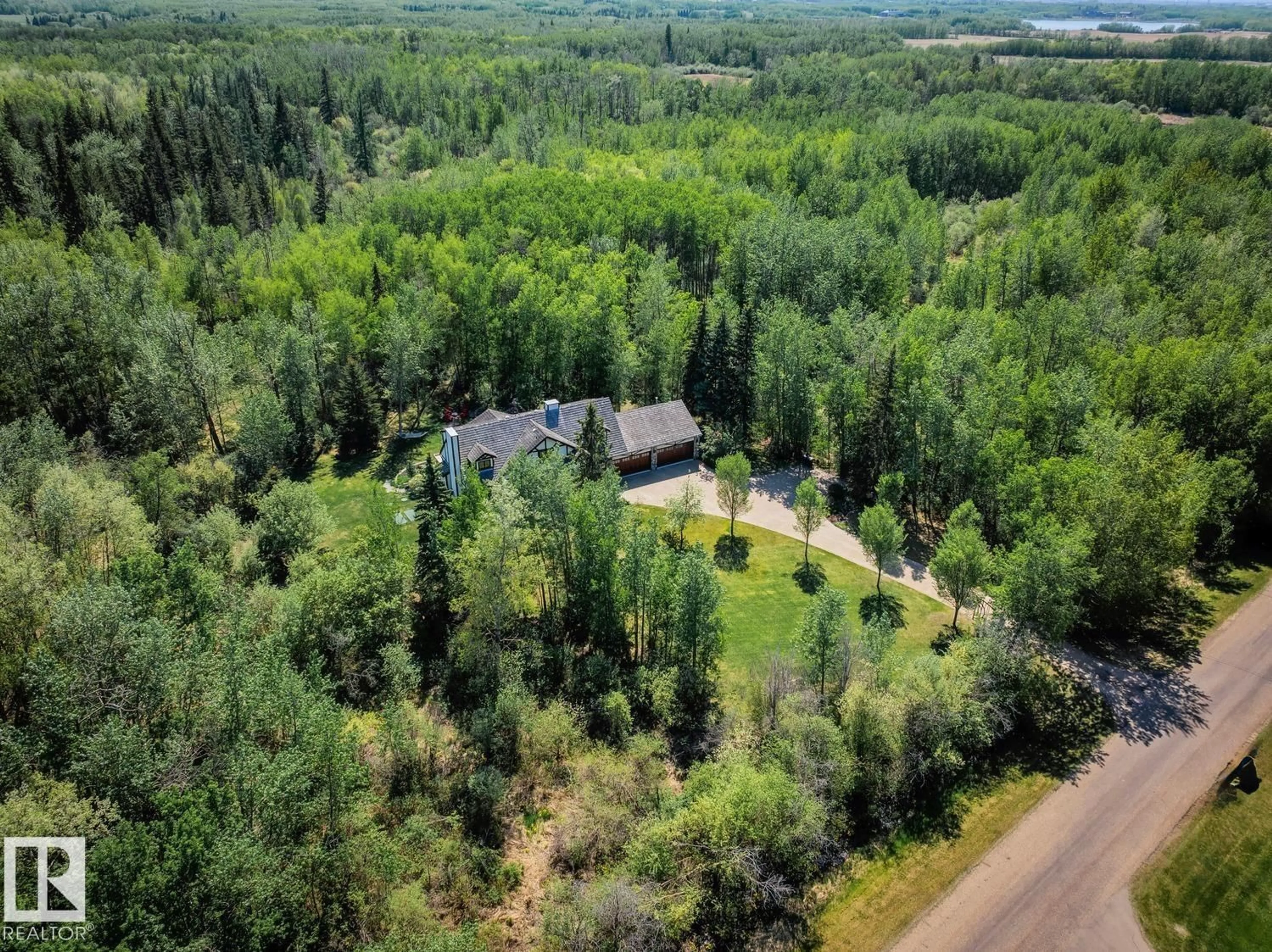 A pic from outside/outdoor area/front of a property/back of a property/a pic from drone, forest/trees view for 49 RGE ROAD 231 RGE ROAD, Rural Strathcona County Alberta T8B1A6