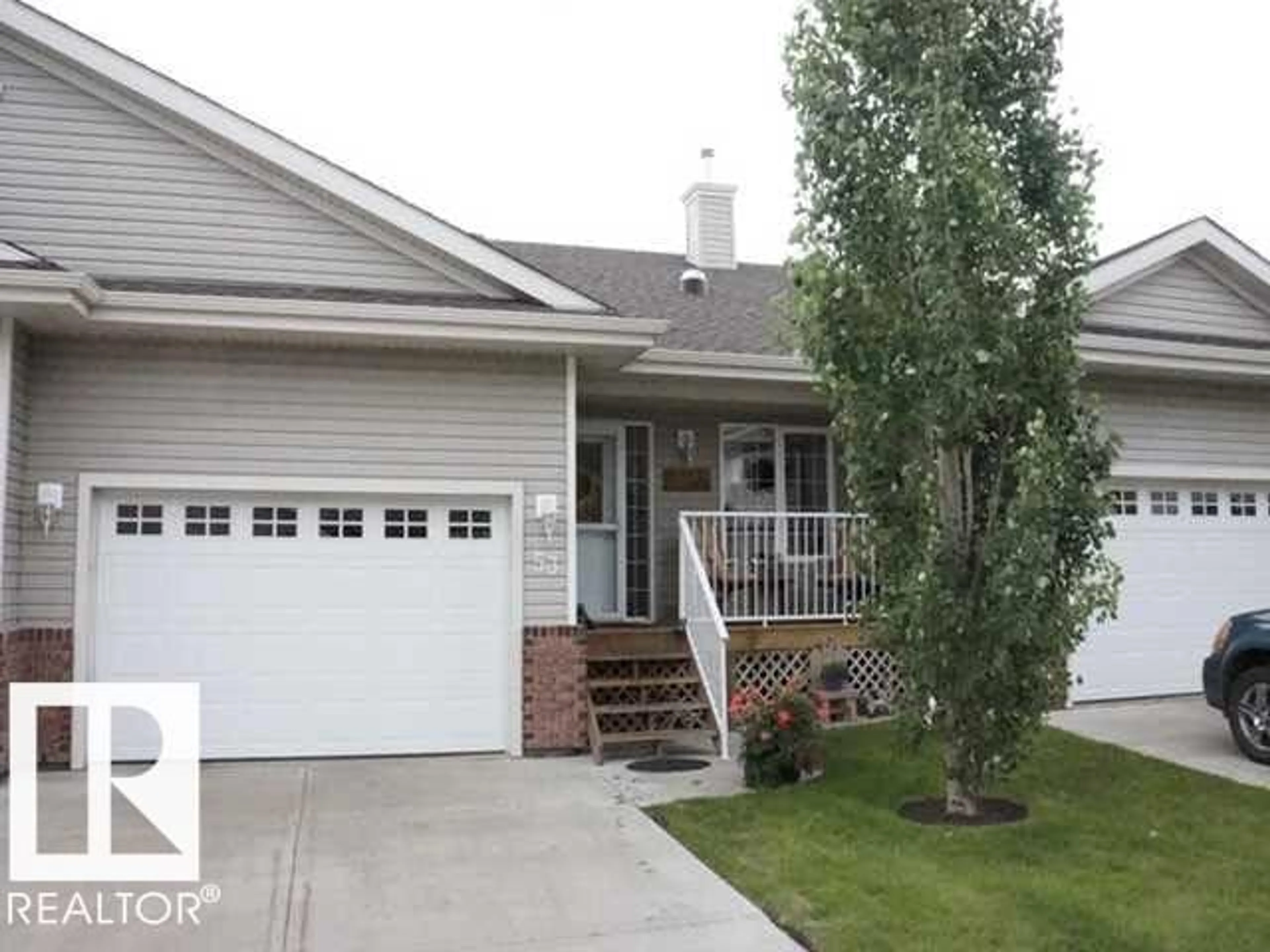 Home with vinyl exterior material, street for 8602 - 53 SOUTHFORT DR, Fort Saskatchewan Alberta T8L4R7