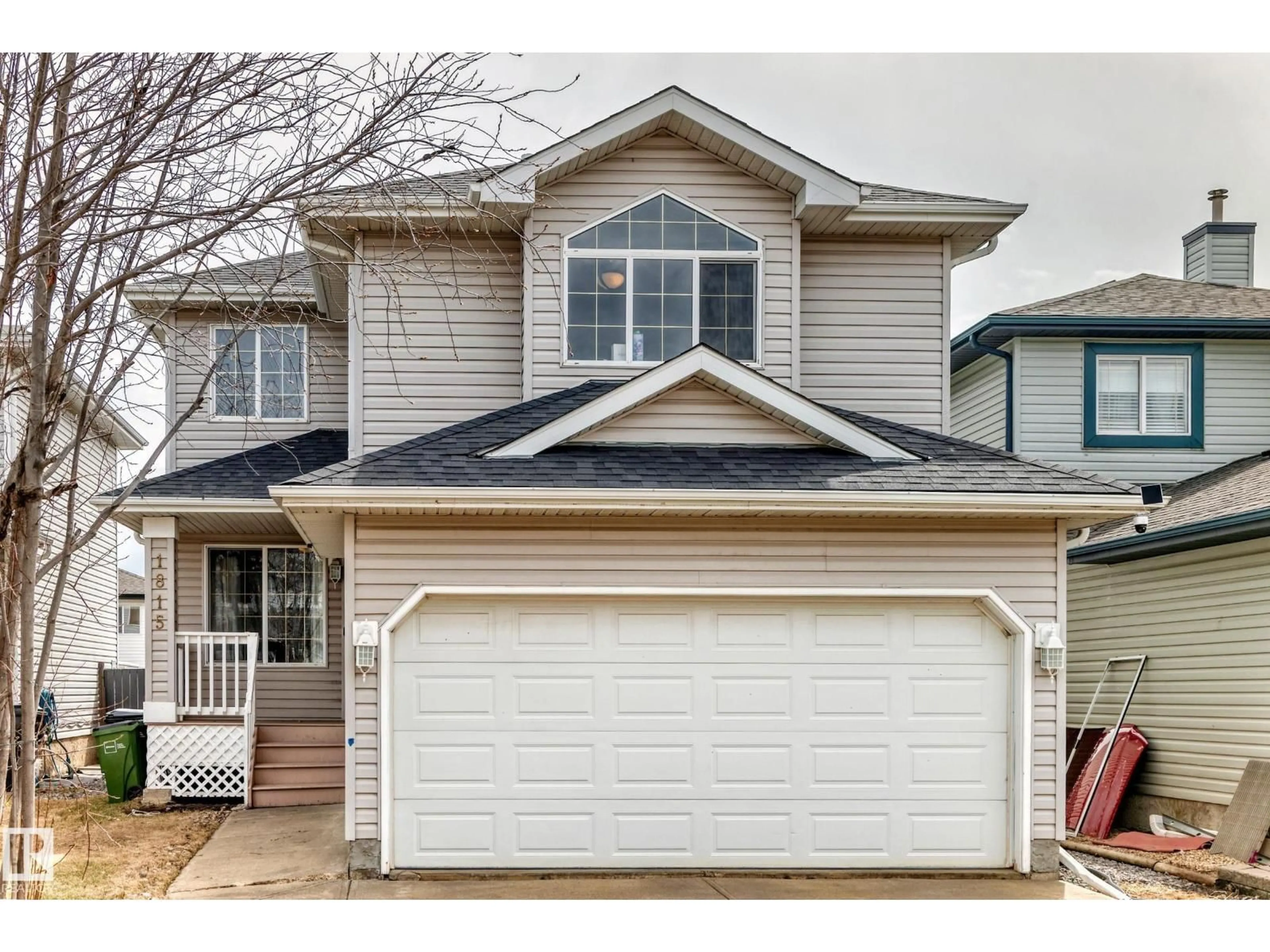 Home with vinyl exterior material, street for 1815 36 AV, Edmonton Alberta T6T1S8