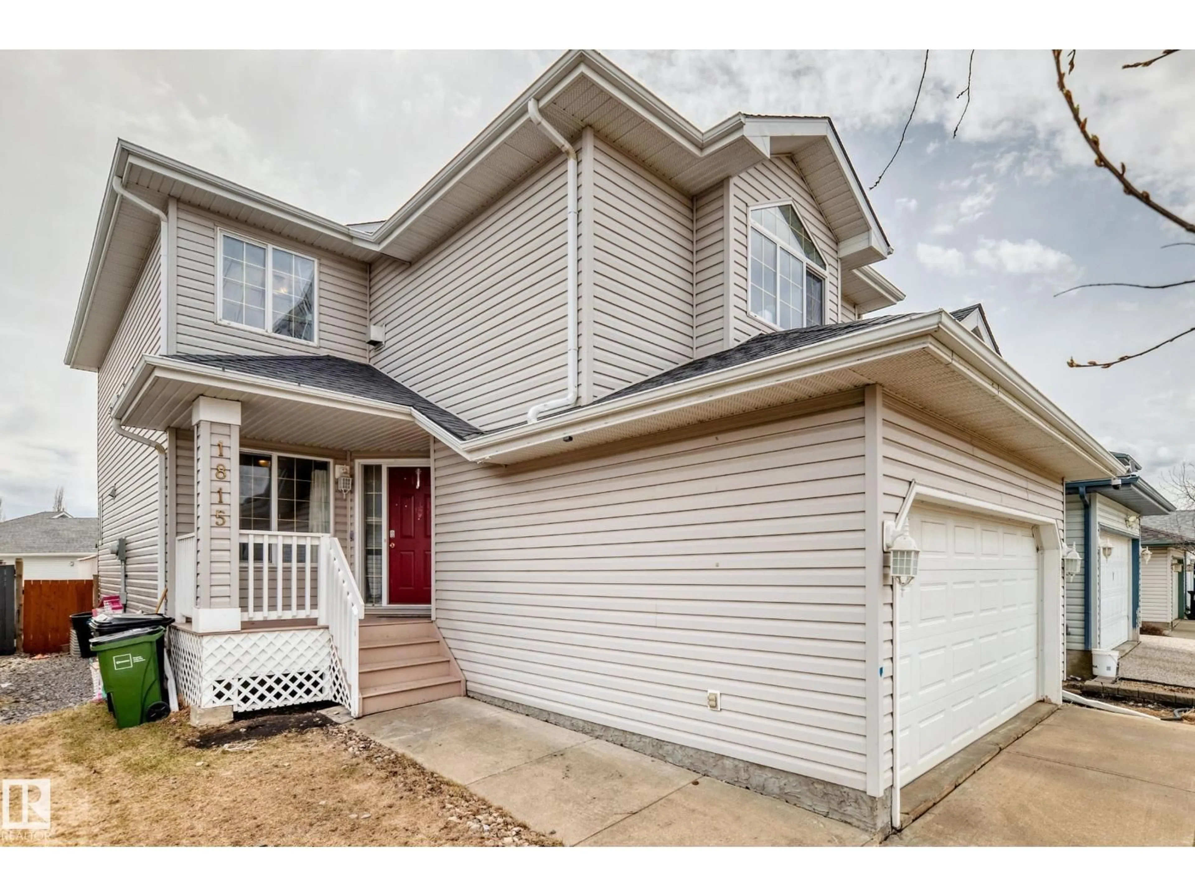 Home with vinyl exterior material, street for 1815 36 AV, Edmonton Alberta T6T1S8