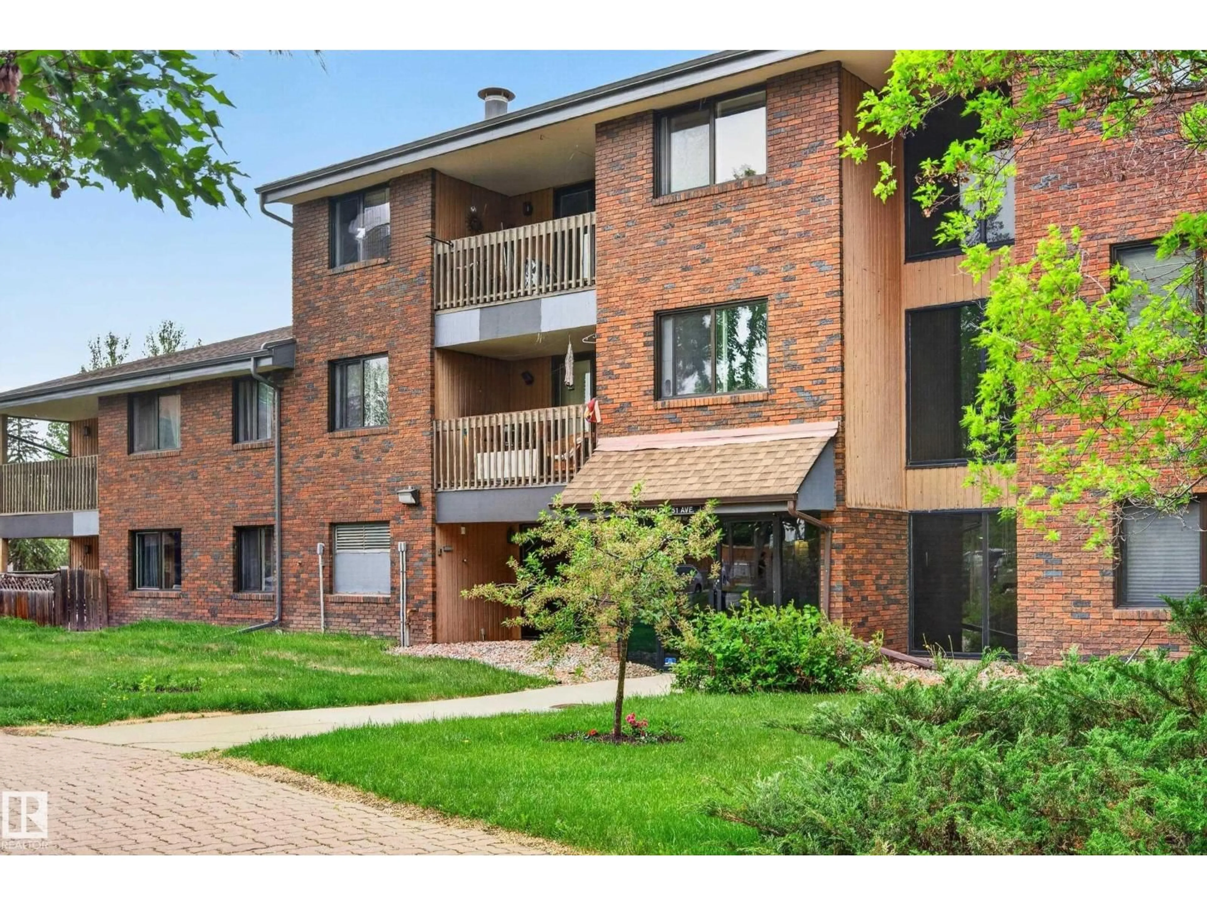 Home with brick exterior material, street for #312 - 14811 51 AV, Edmonton Alberta T6H5G4