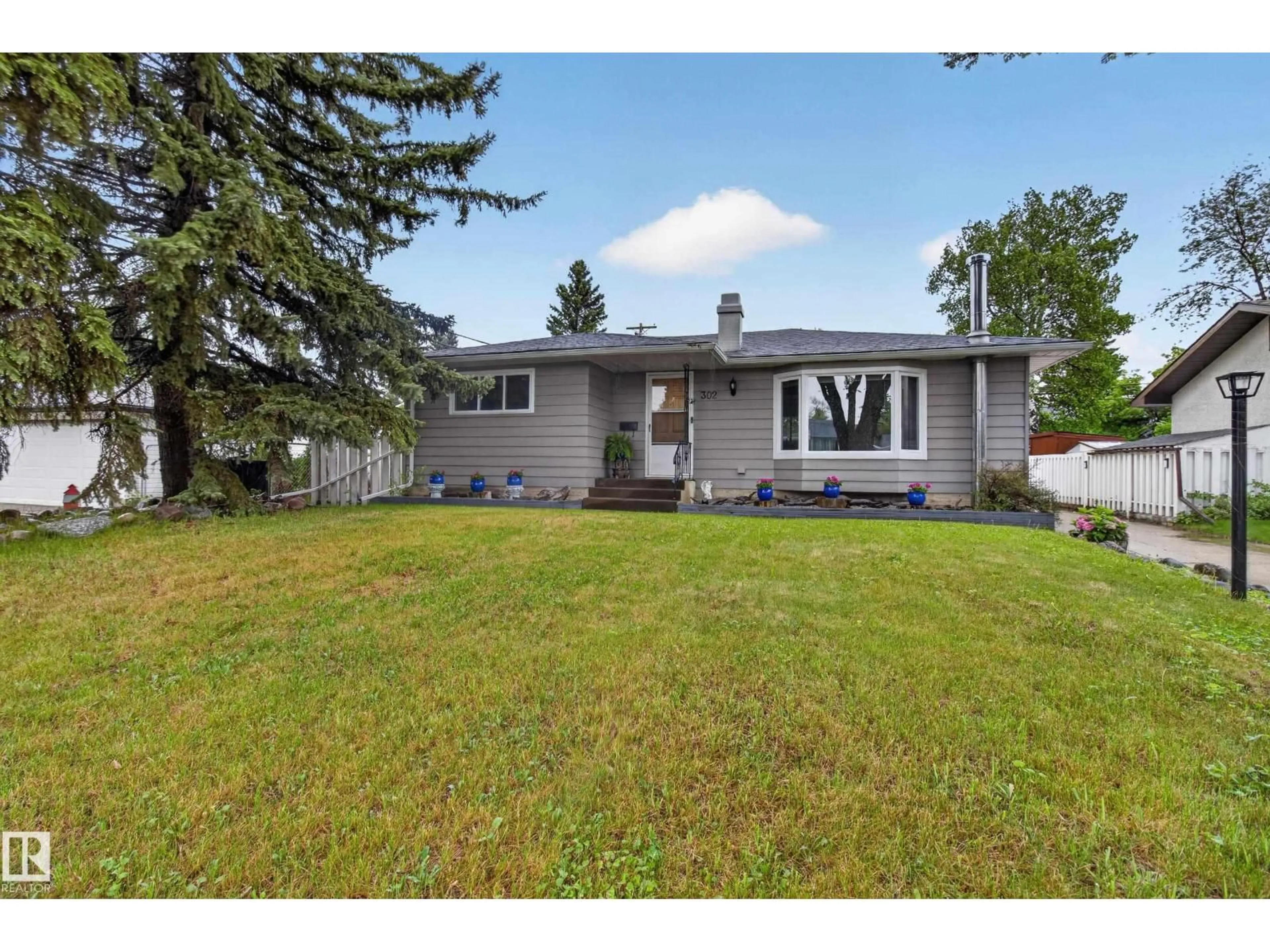 Home with vinyl exterior material, street for 302 FIR ST, Sherwood Park Alberta T8A2B3