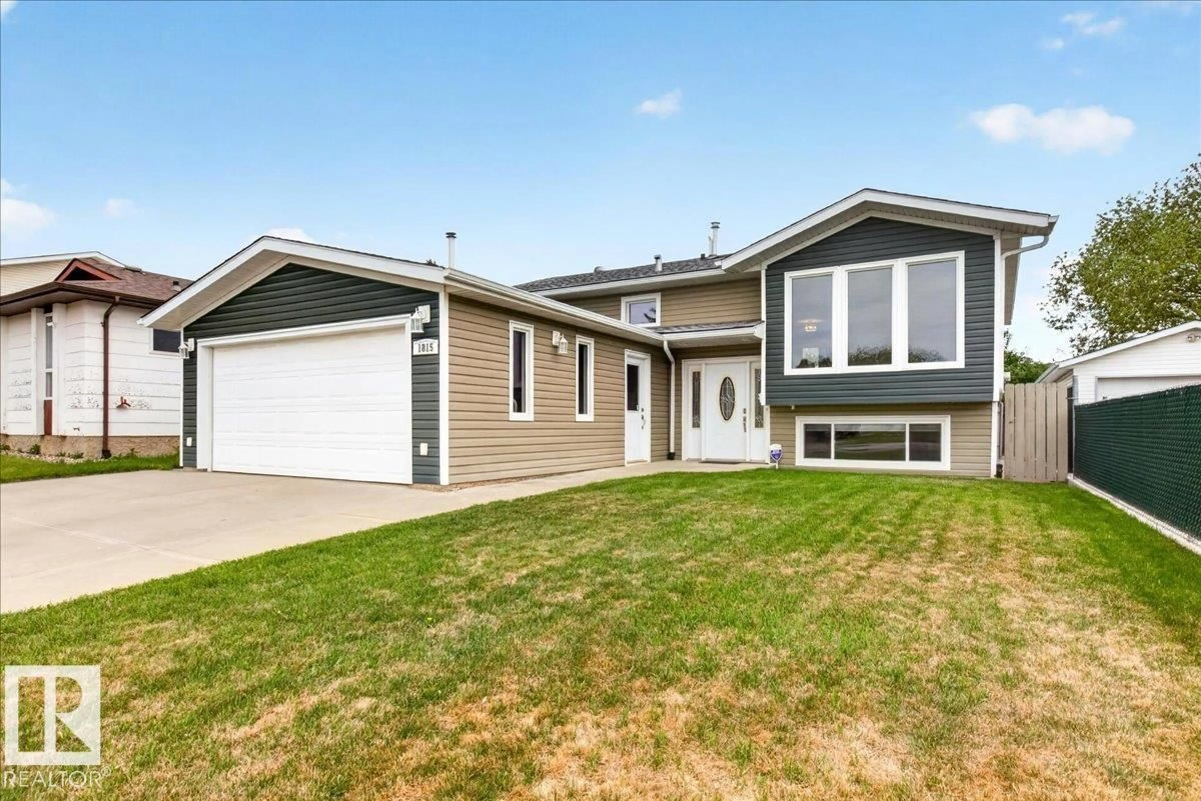 Home with vinyl exterior material, street for NW - 1815 42 ST, Edmonton Alberta T6L3H6