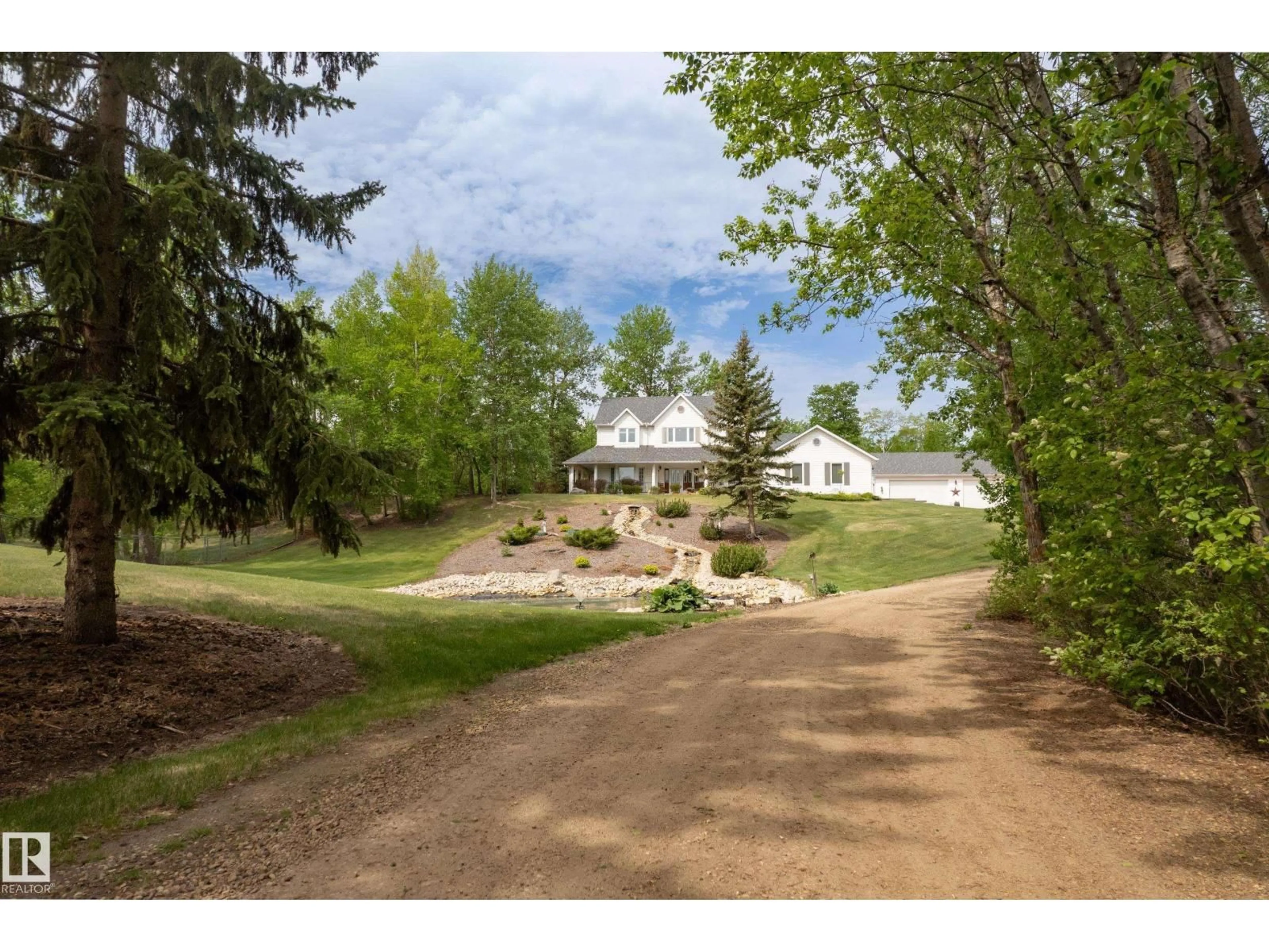 A pic from outside/outdoor area/front of a property/back of a property/a pic from drone, unknown for #210 - 50470 RGE RD 234 NW, Rural Leduc County Alberta T4X0L7