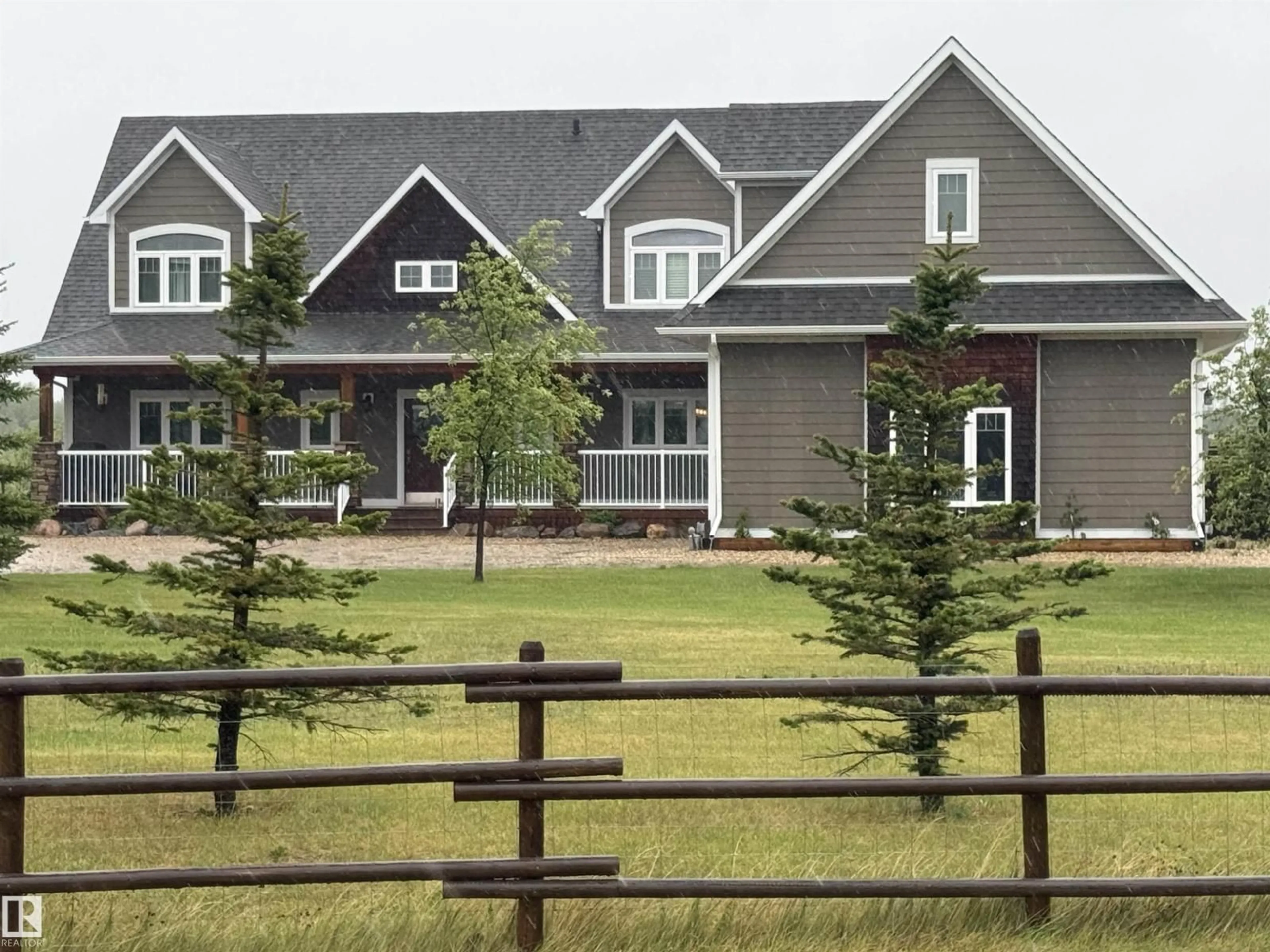 Home with vinyl exterior material, mountain view for 243050 TWP ROAD 474, Rural Wetaskiwin County Alberta T0C1Z0