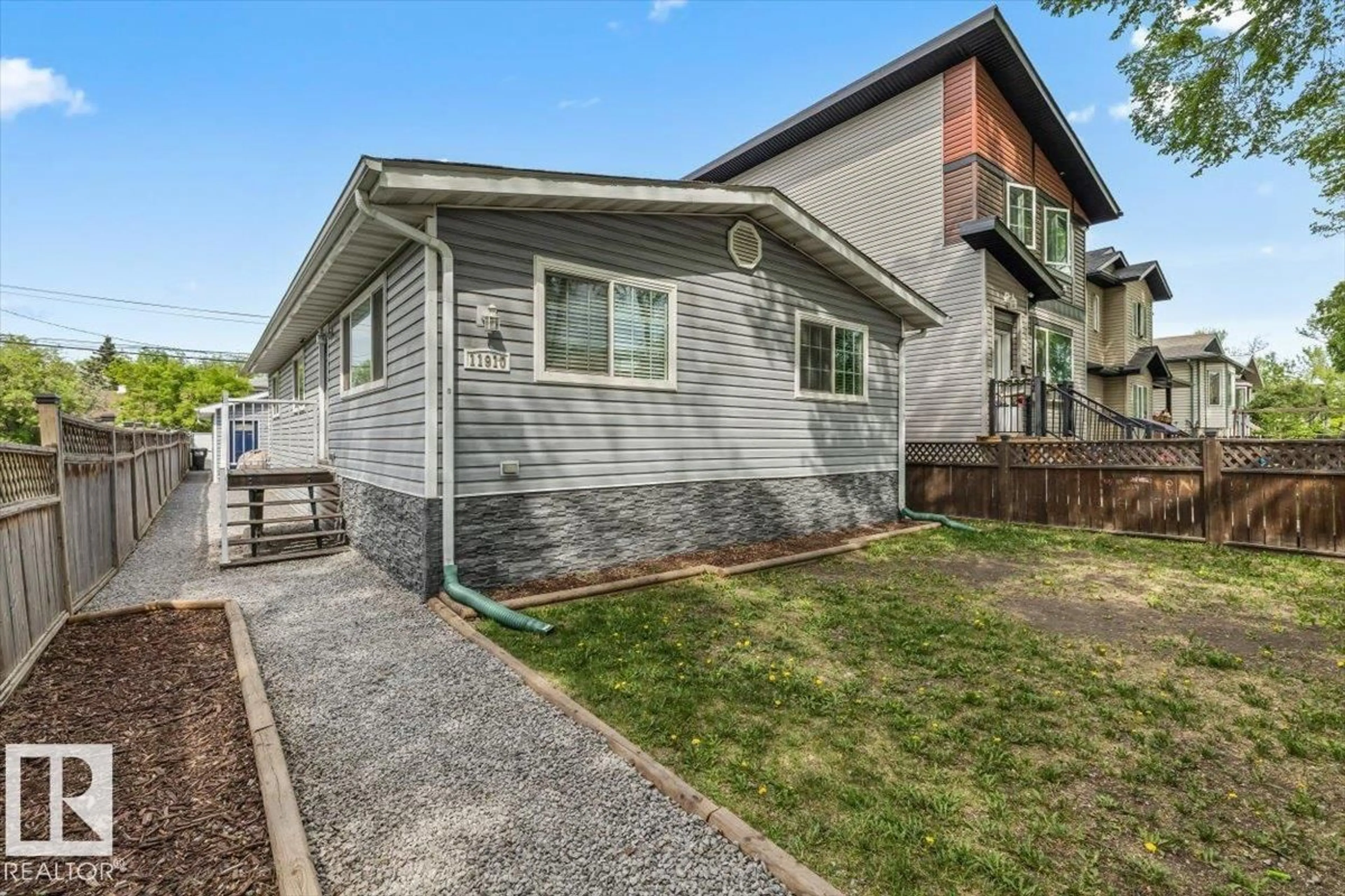 Home with vinyl exterior material, street for 11910 95 ST, Edmonton Alberta T5G1R5
