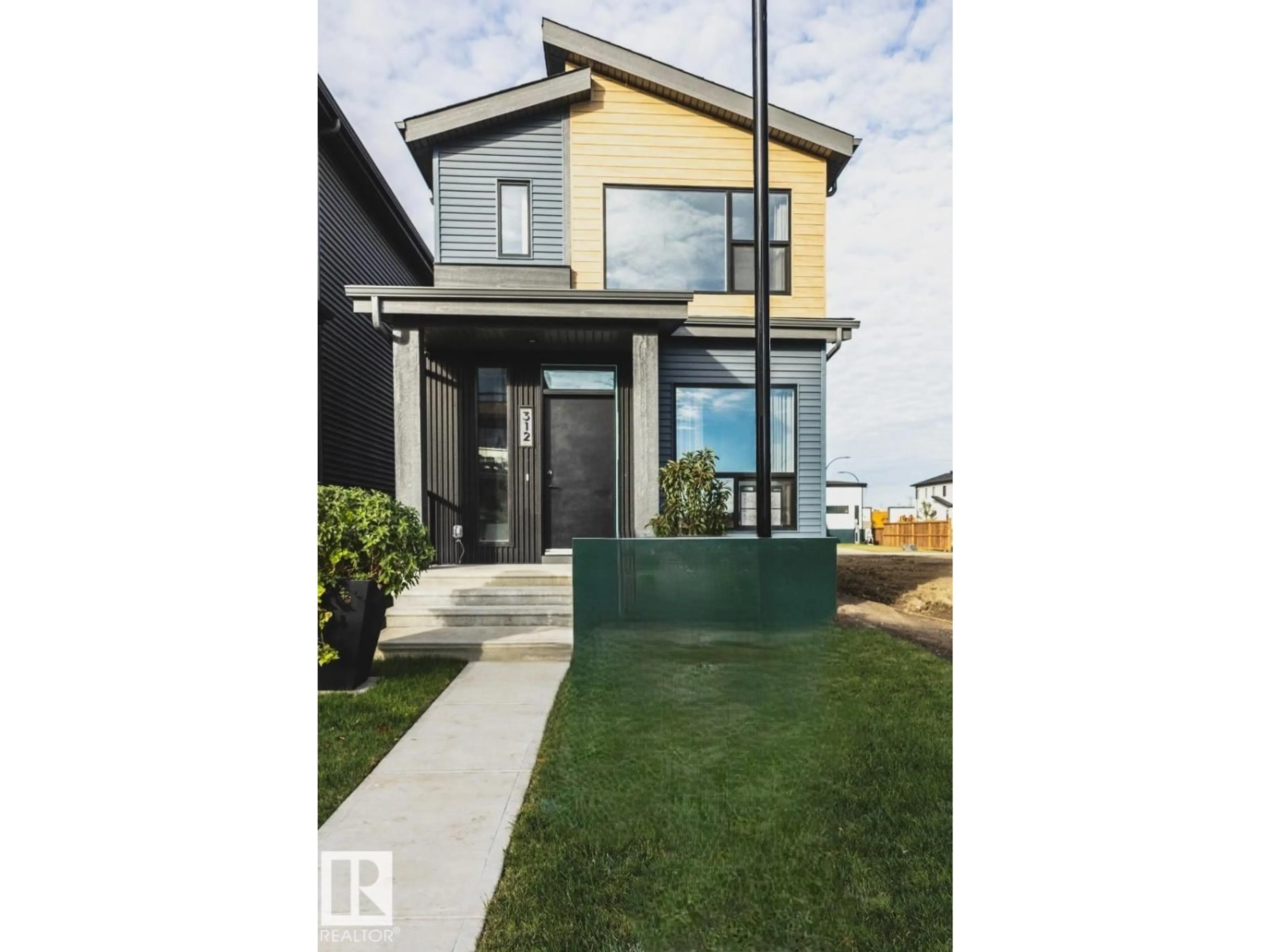 Home with vinyl exterior material, street for SW - 312 32 ST, Edmonton Alberta T6X3C8