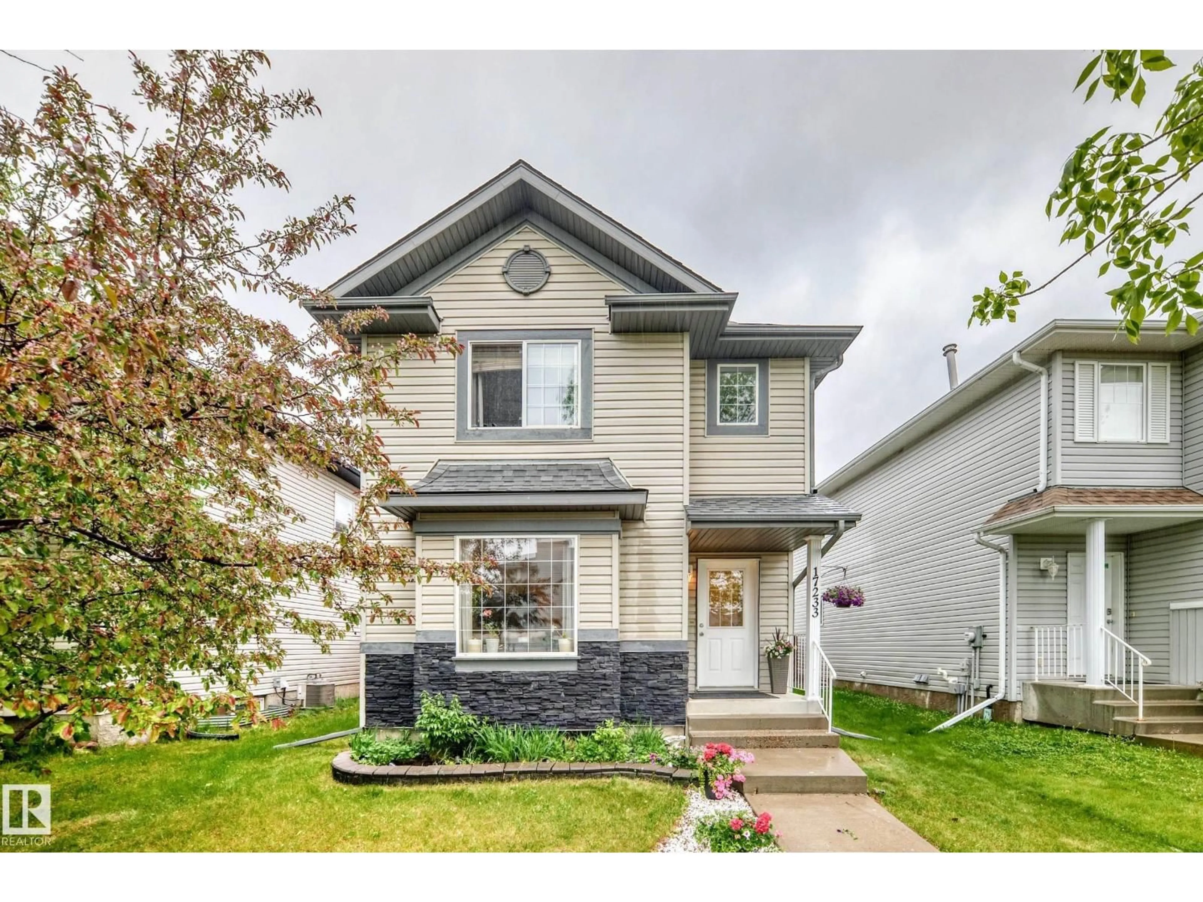Home with vinyl exterior material, street for 17233 88 ST, Edmonton Alberta T5Z3R4