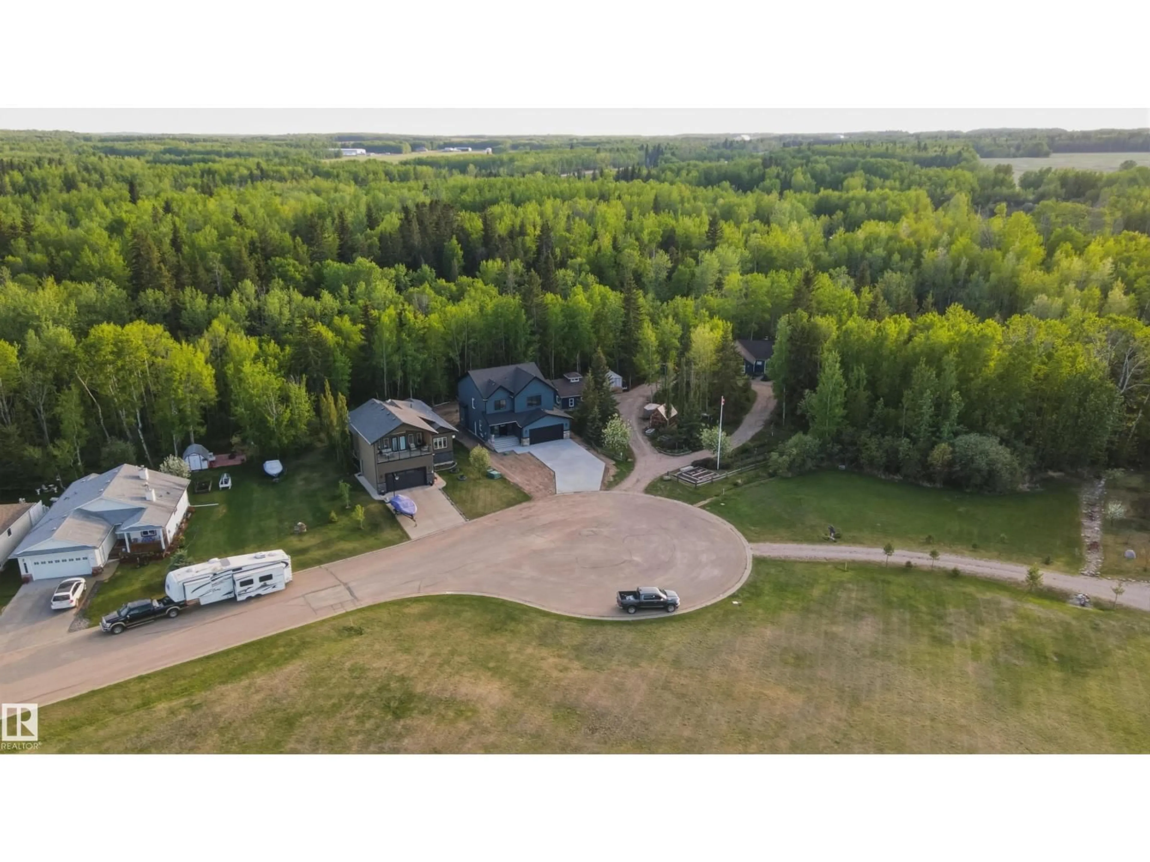 A pic from outside/outdoor area/front of a property/back of a property/a pic from drone, forest/trees view for 132 HERON POINT CL, Rural Wetaskiwin County Alberta T0C2V0