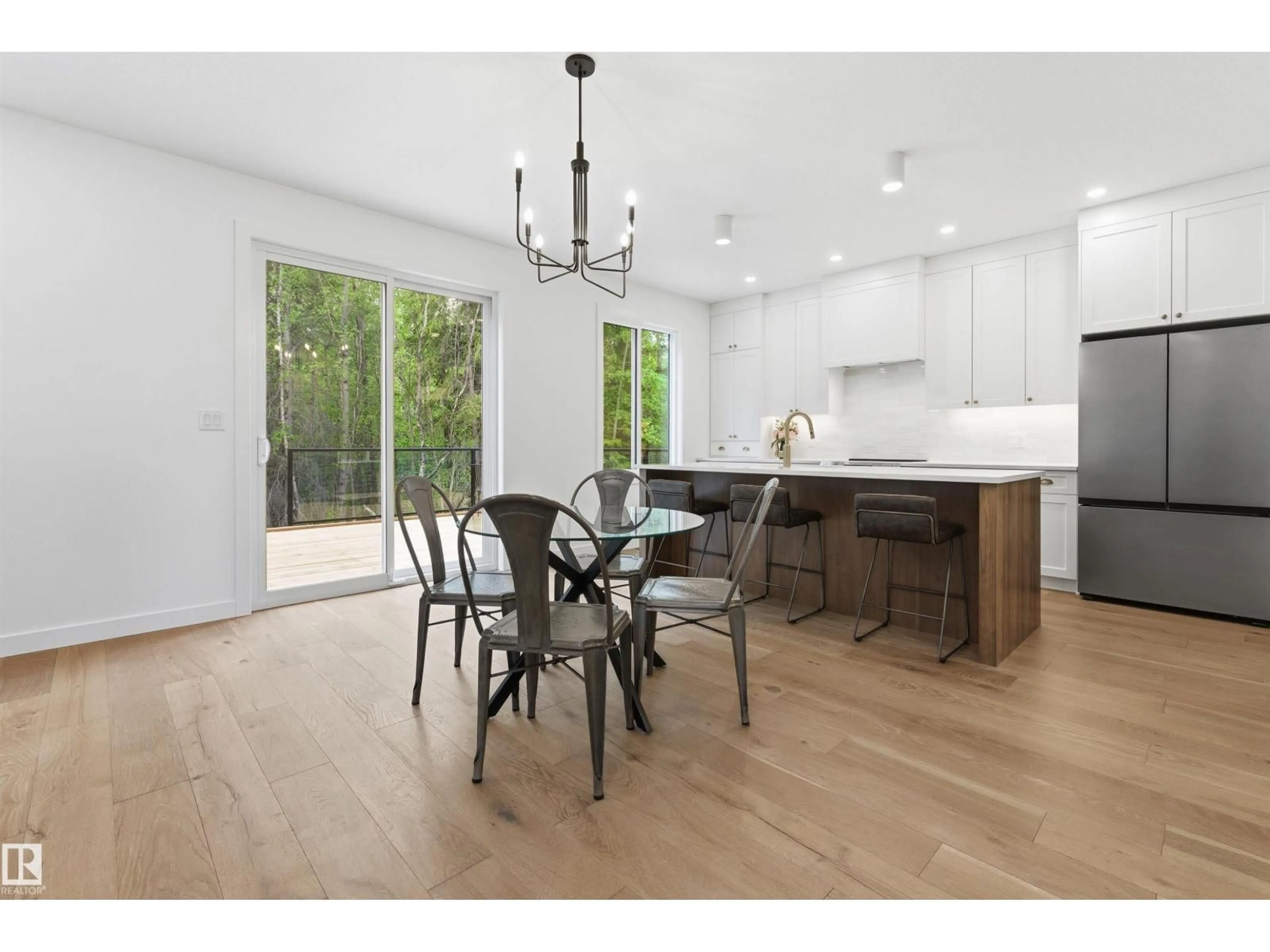 Open concept kitchen, wood/laminate floor for 132 HERON POINT CL, Rural Wetaskiwin County Alberta T0C2V0