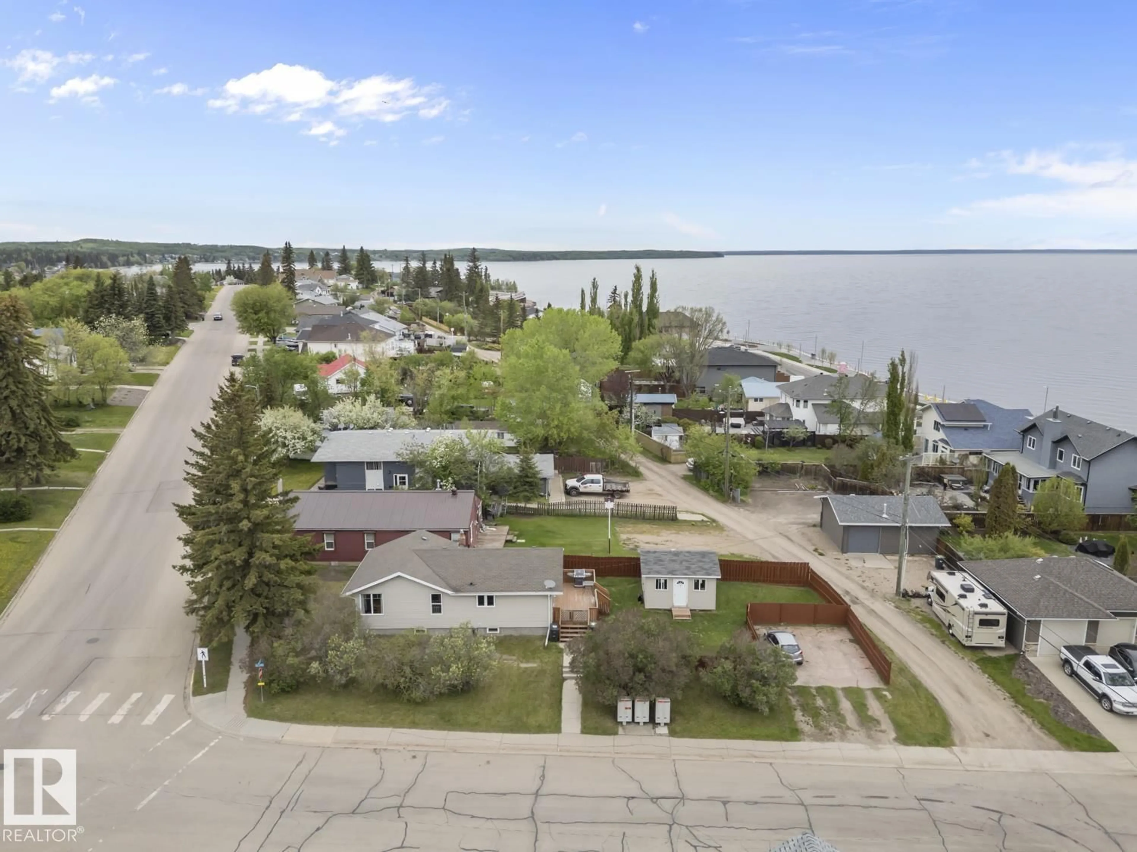 A pic from outside/outdoor area/front of a property/back of a property/a pic from drone, water/lake/river/ocean view for 520 10 ST, Cold Lake Alberta T9M1A2