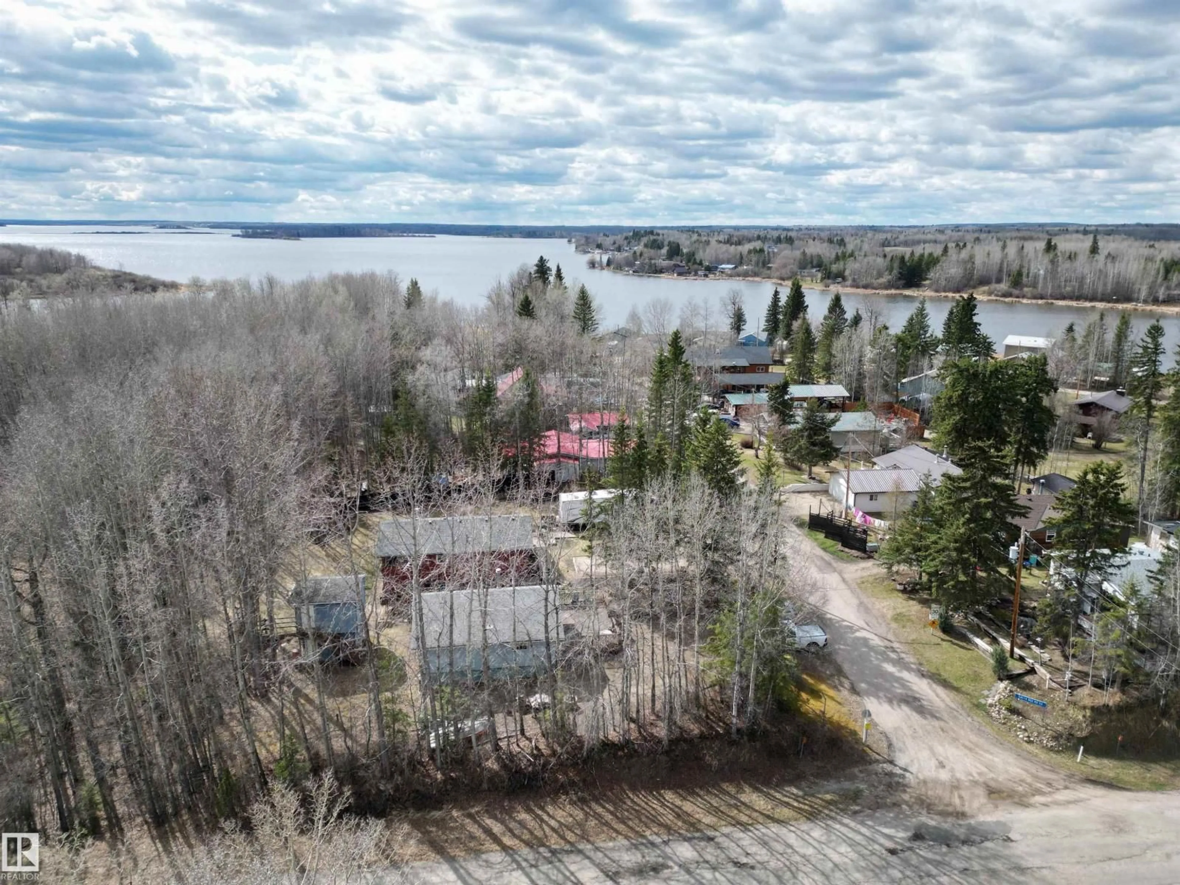 A pic from outside/outdoor area/front of a property/back of a property/a pic from drone, water/lake/river/ocean view for 54114 RGE ROAD 52, Rural Lac Ste. Anne County Alberta T0E1H0
