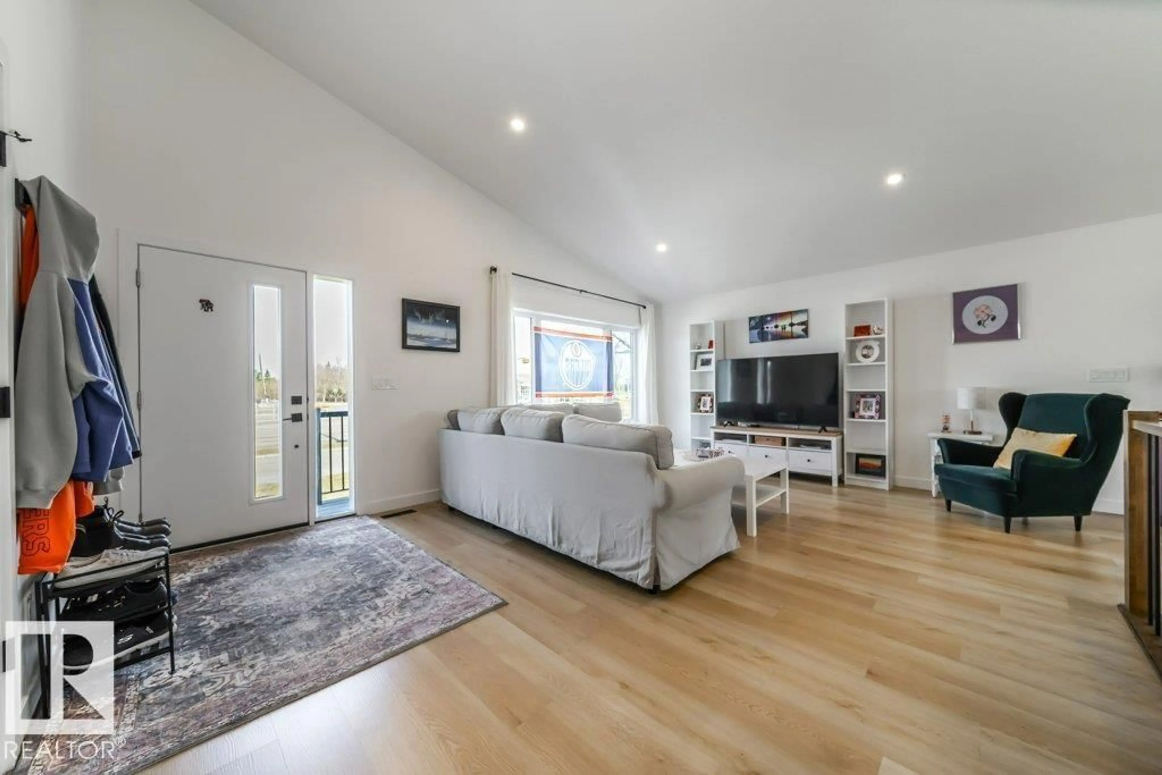 Living room with furniture, wood/laminate floor for 11303 111 AV, Edmonton Alberta T5G0C8