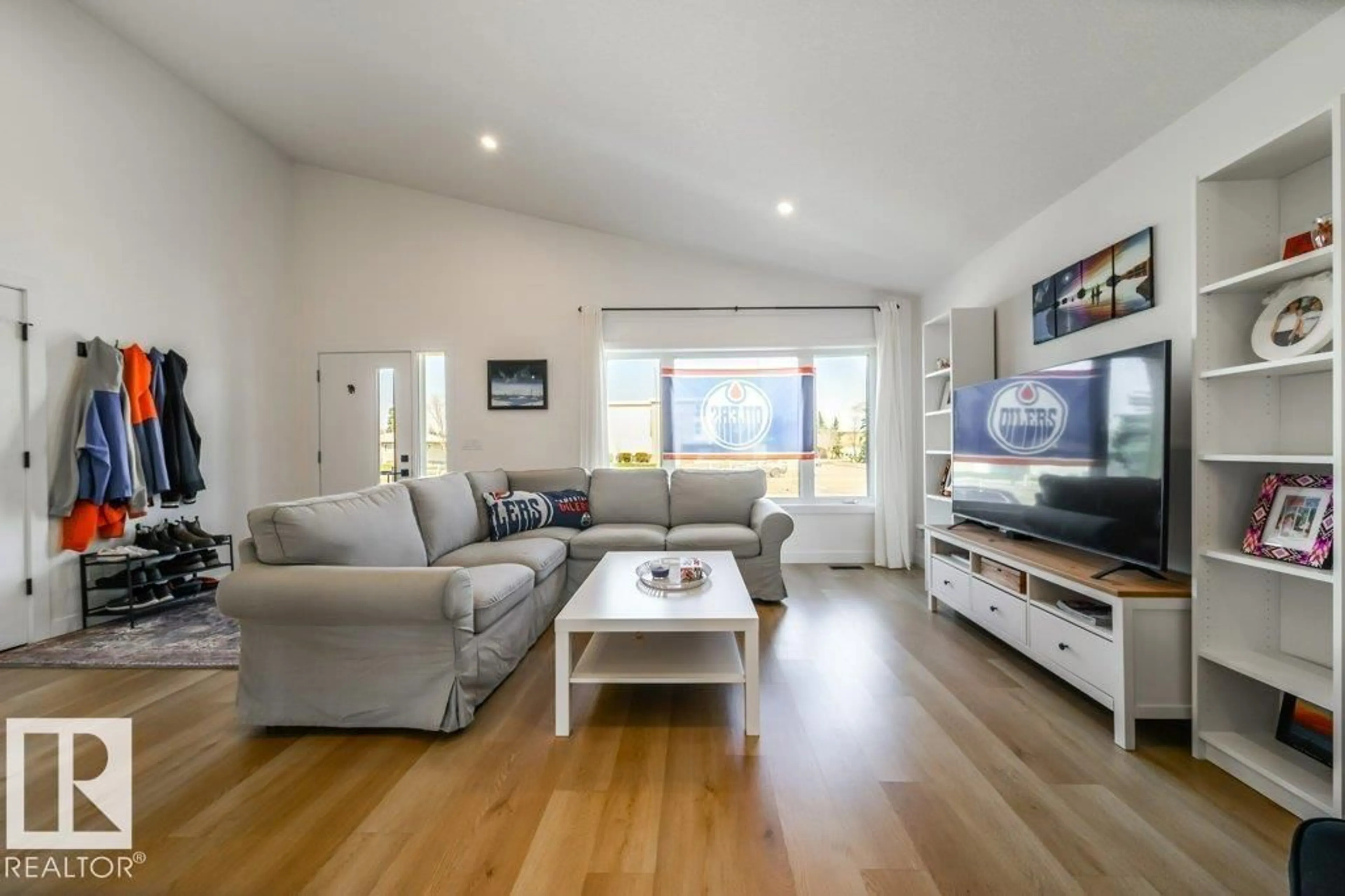 Living room with furniture, wood/laminate floor for 11303 111 AV, Edmonton Alberta T5G0C8