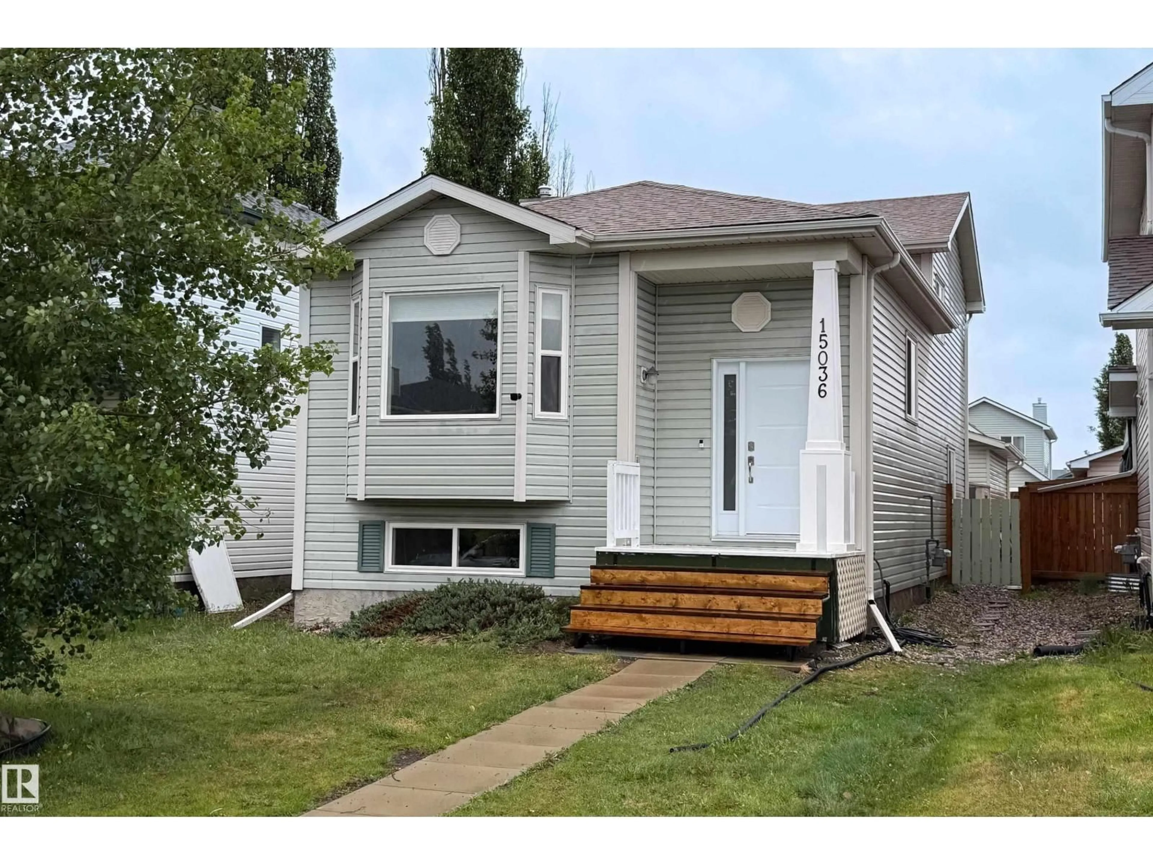 Home with vinyl exterior material, street for 15036 131 ST NW, Edmonton Alberta T6V1K3