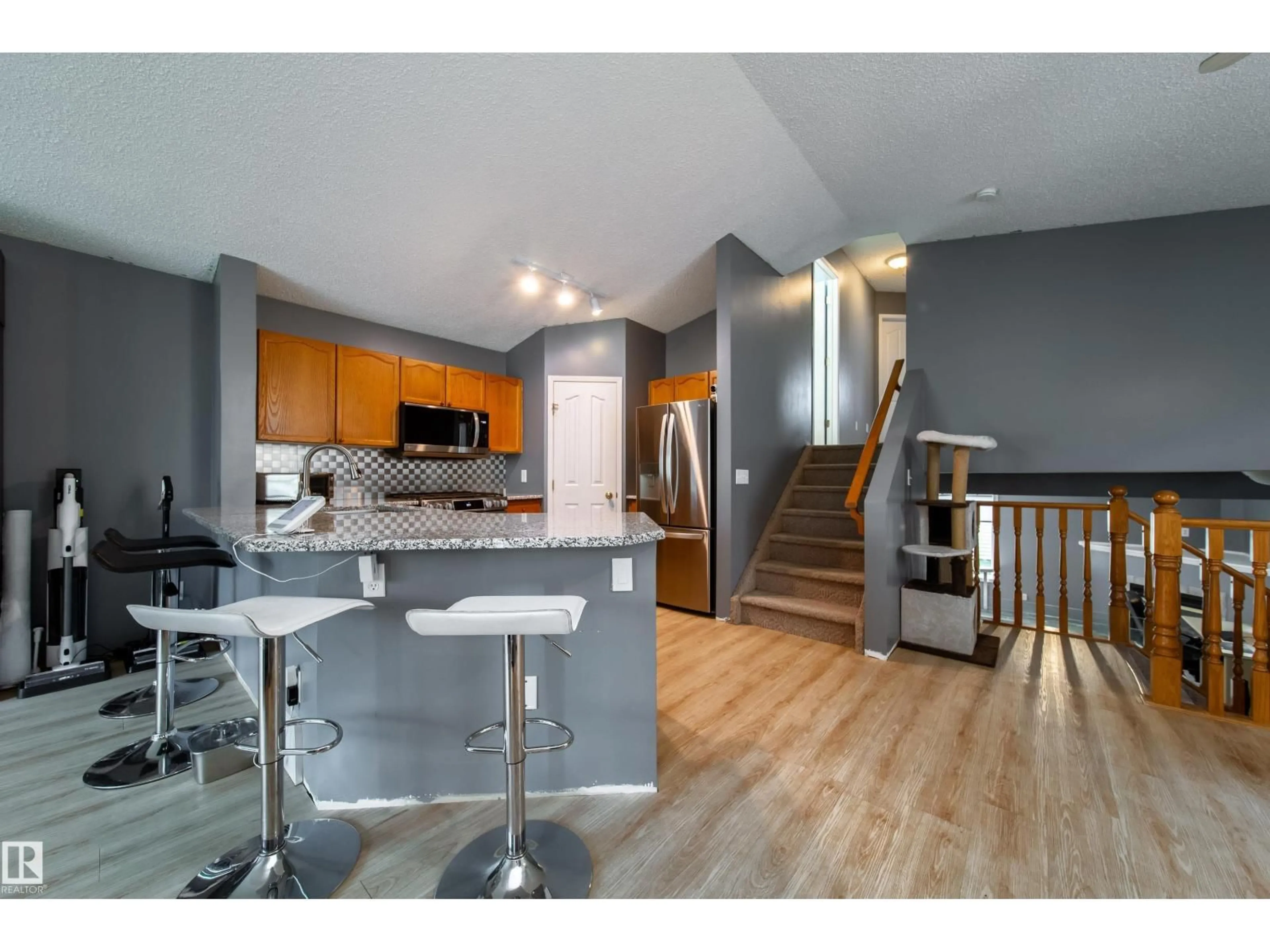 Open concept kitchen, wood/laminate floor for 15036 131 ST NW, Edmonton Alberta T6V1K3