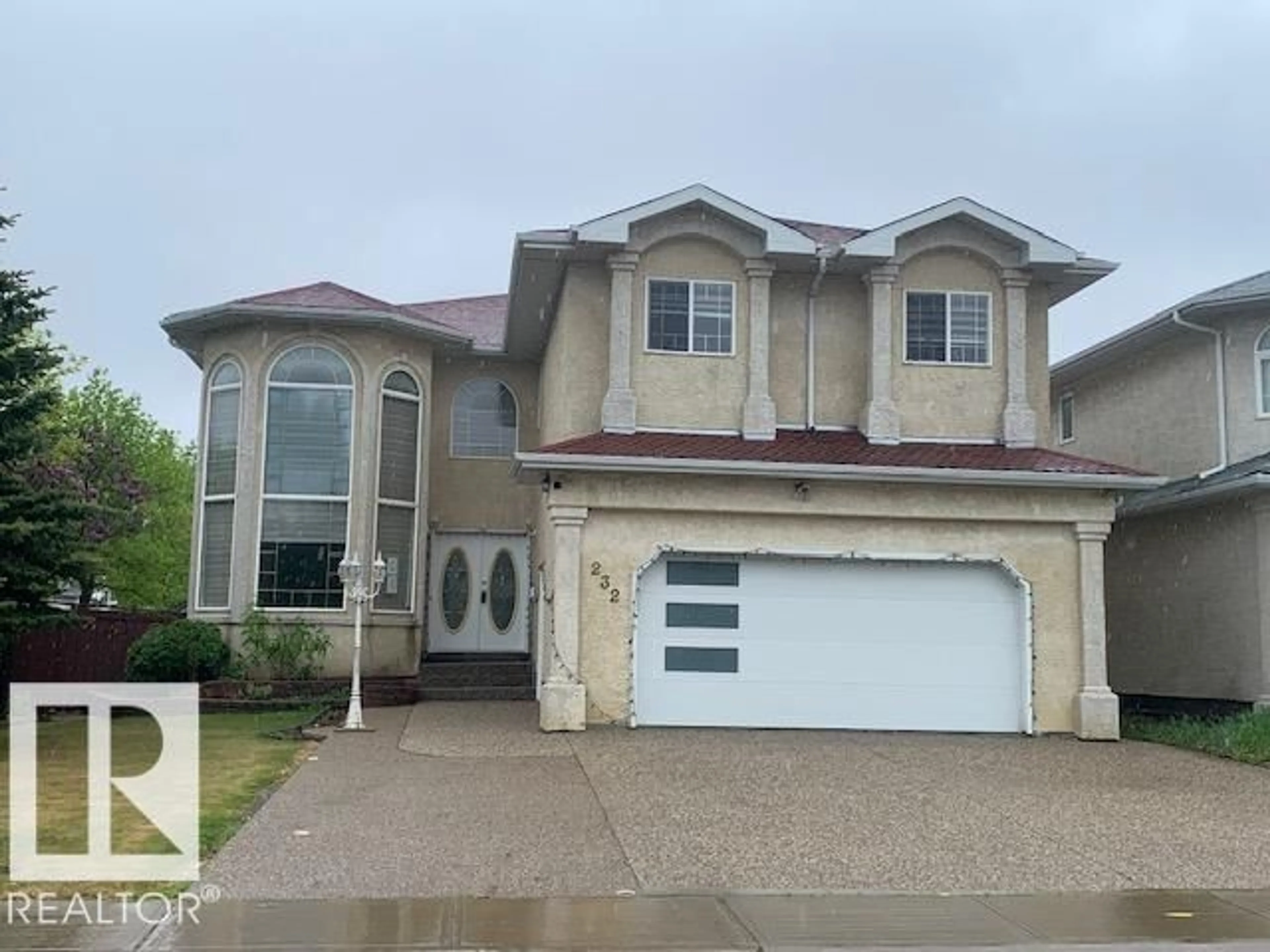 Home with vinyl exterior material, street for 232 KULAWY DR, Edmonton Alberta T6L7E5