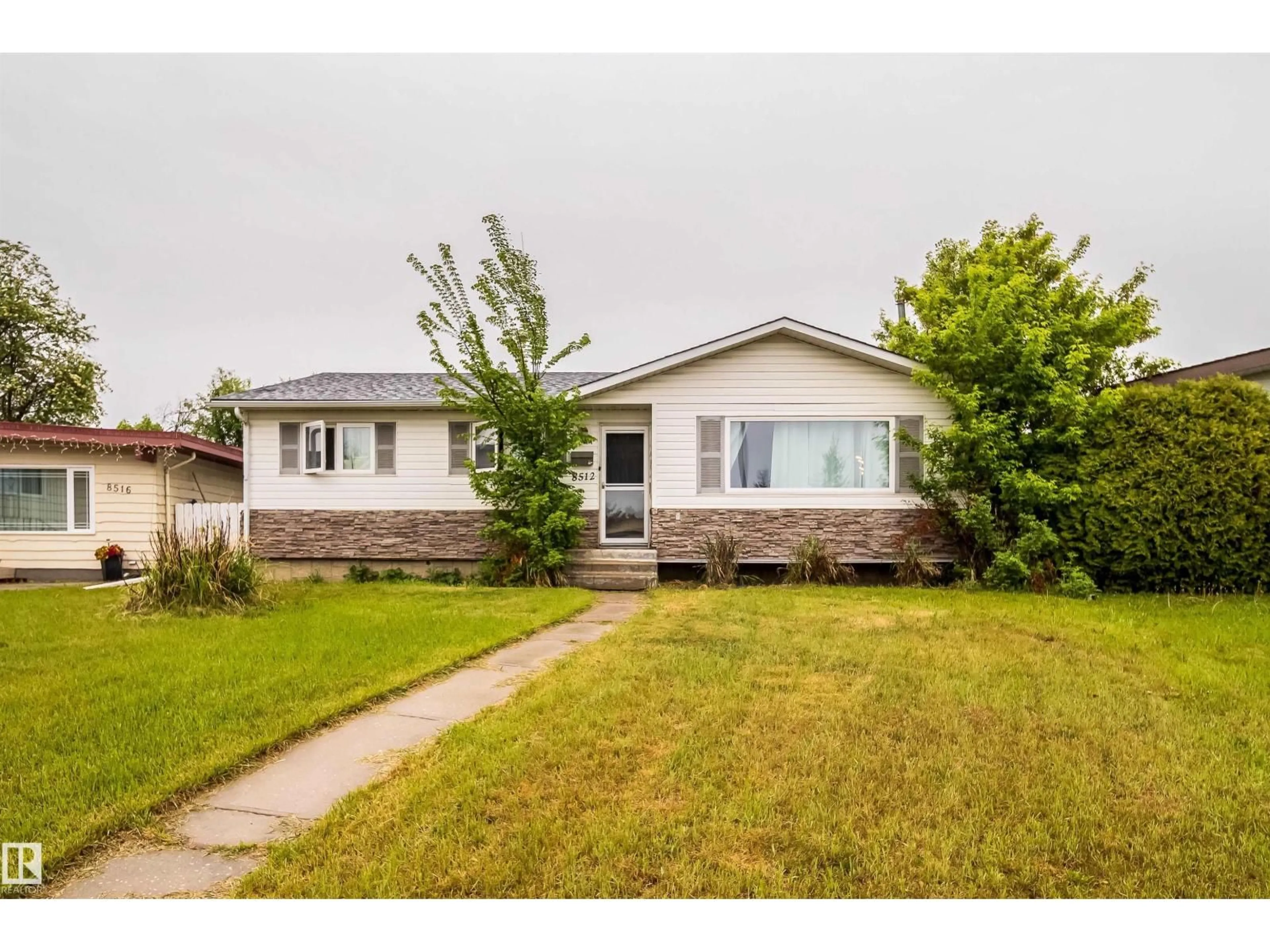 Home with vinyl exterior material, street for 8512 142A AV, Edmonton Alberta T5E2G7