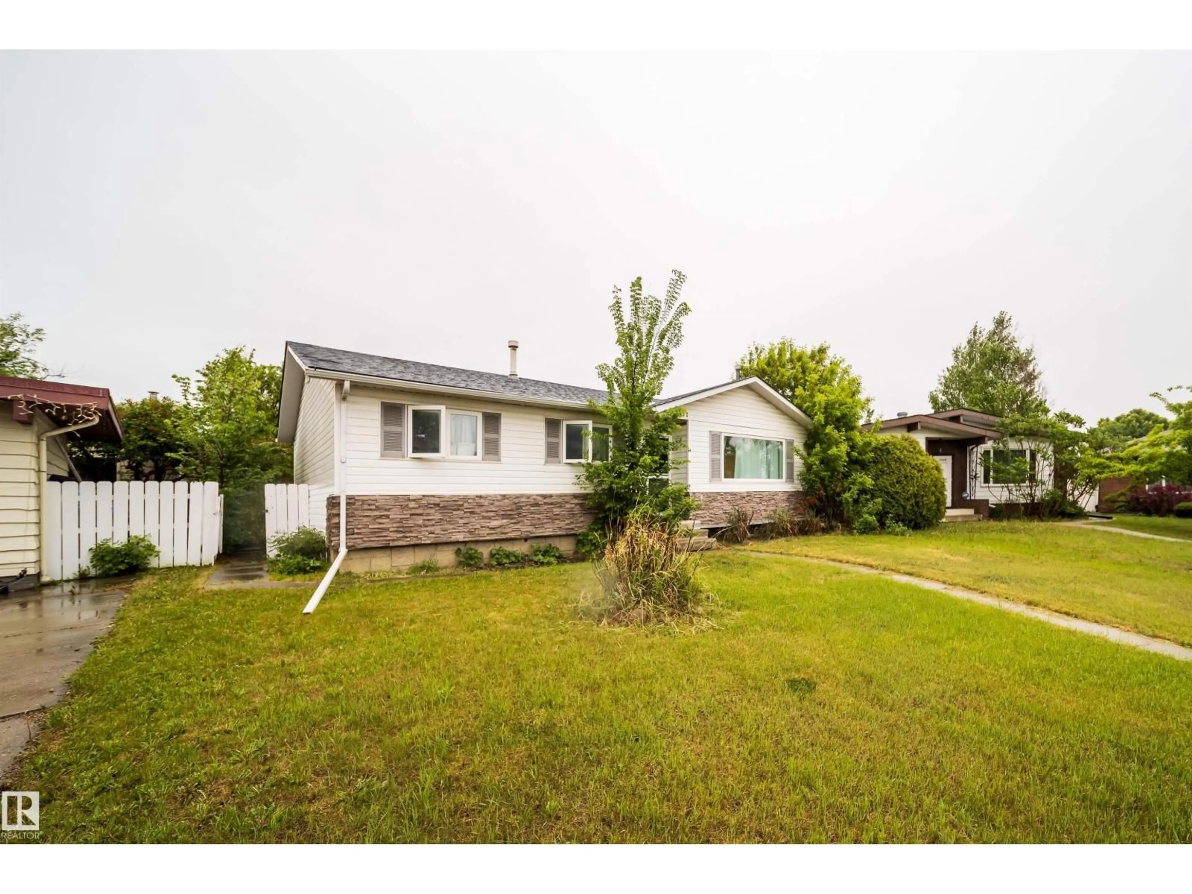 A pic from outside/outdoor area/front of a property/back of a property/a pic from drone, street for 8512 142A AV, Edmonton Alberta T5E2G7