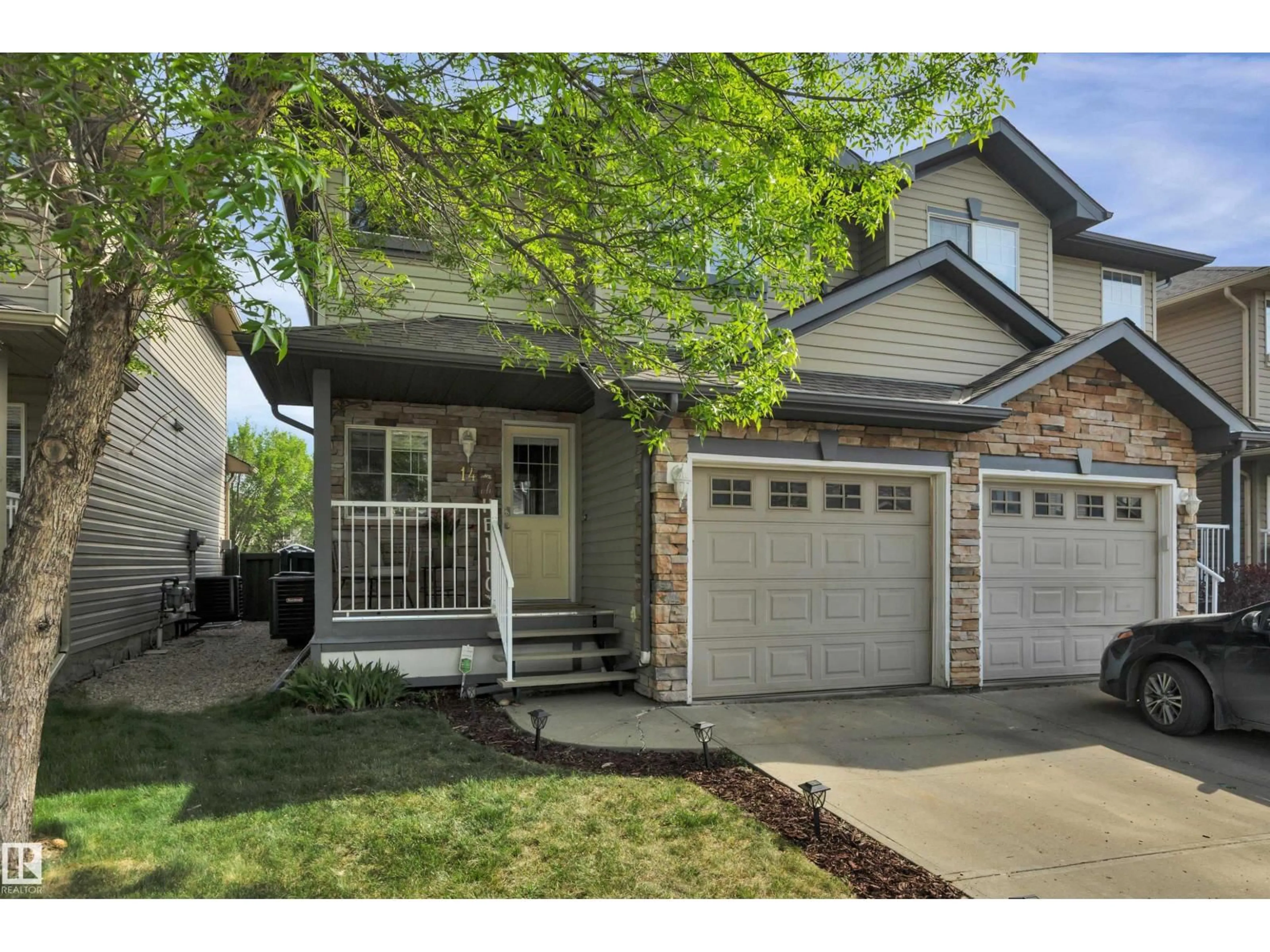 Home with vinyl exterior material, street for 12104 16 AV, Edmonton Alberta T6W1X3