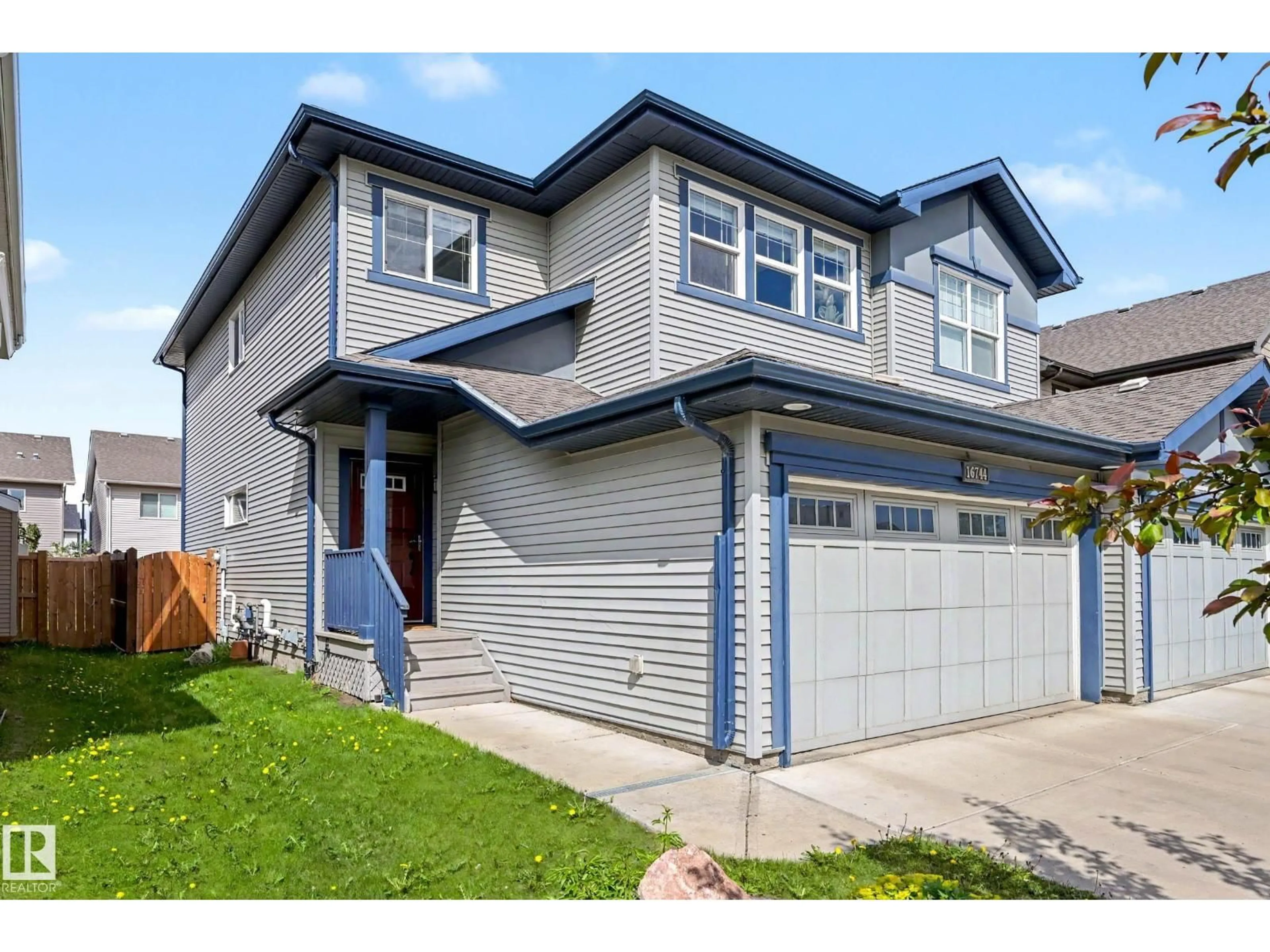 Home with vinyl exterior material, street for 16744 64 ST, Edmonton Alberta T5Y3P8