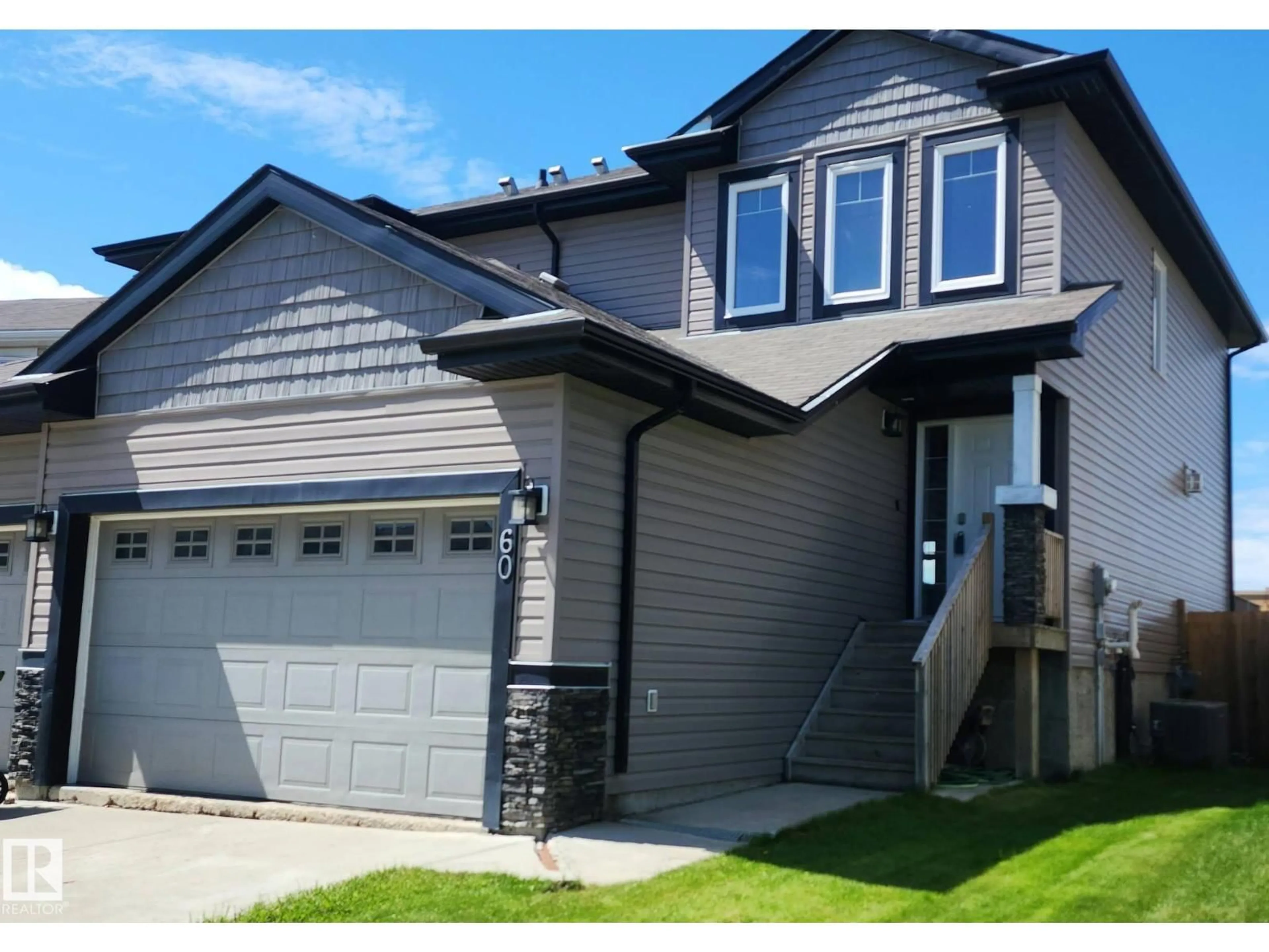 Home with vinyl exterior material, street for 60 DUNLOP WD, Leduc Alberta T9E0N3