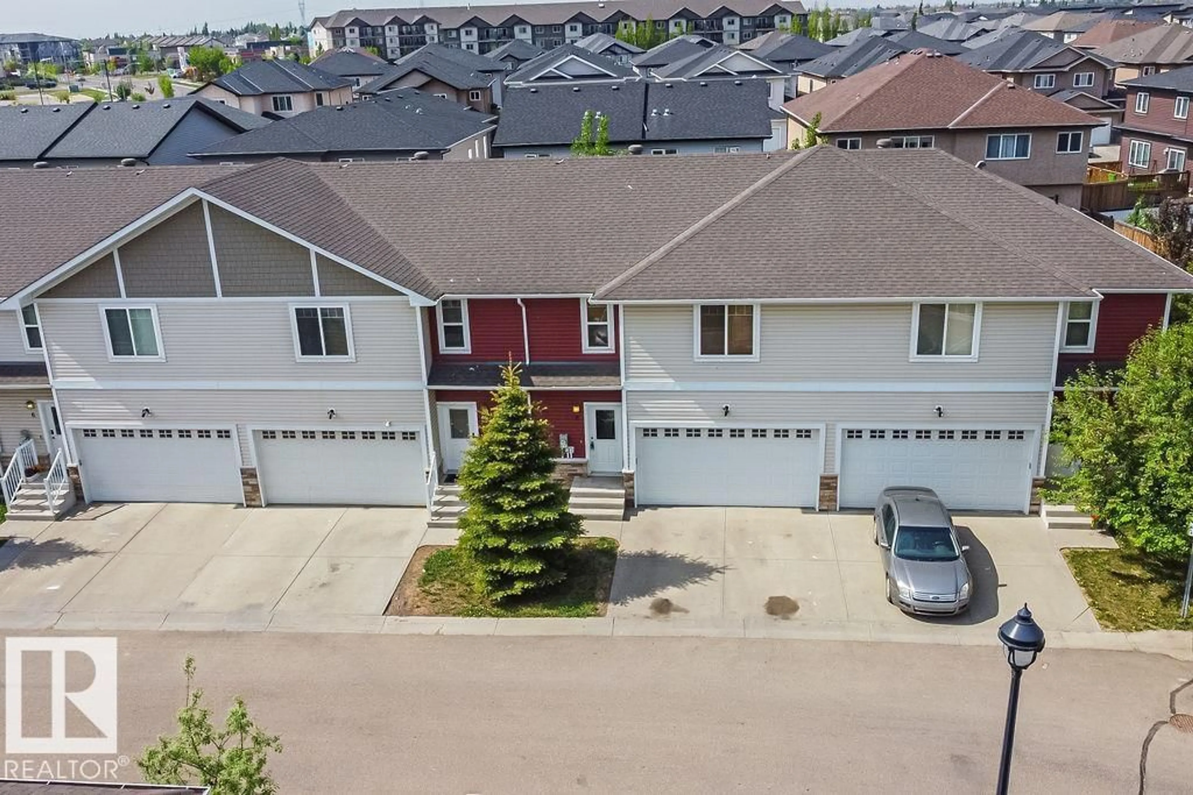 A pic from outside/outdoor area/front of a property/back of a property/a pic from drone, street for #8 - 450 MCCONACHIE WY, Edmonton Alberta T5Y0S8