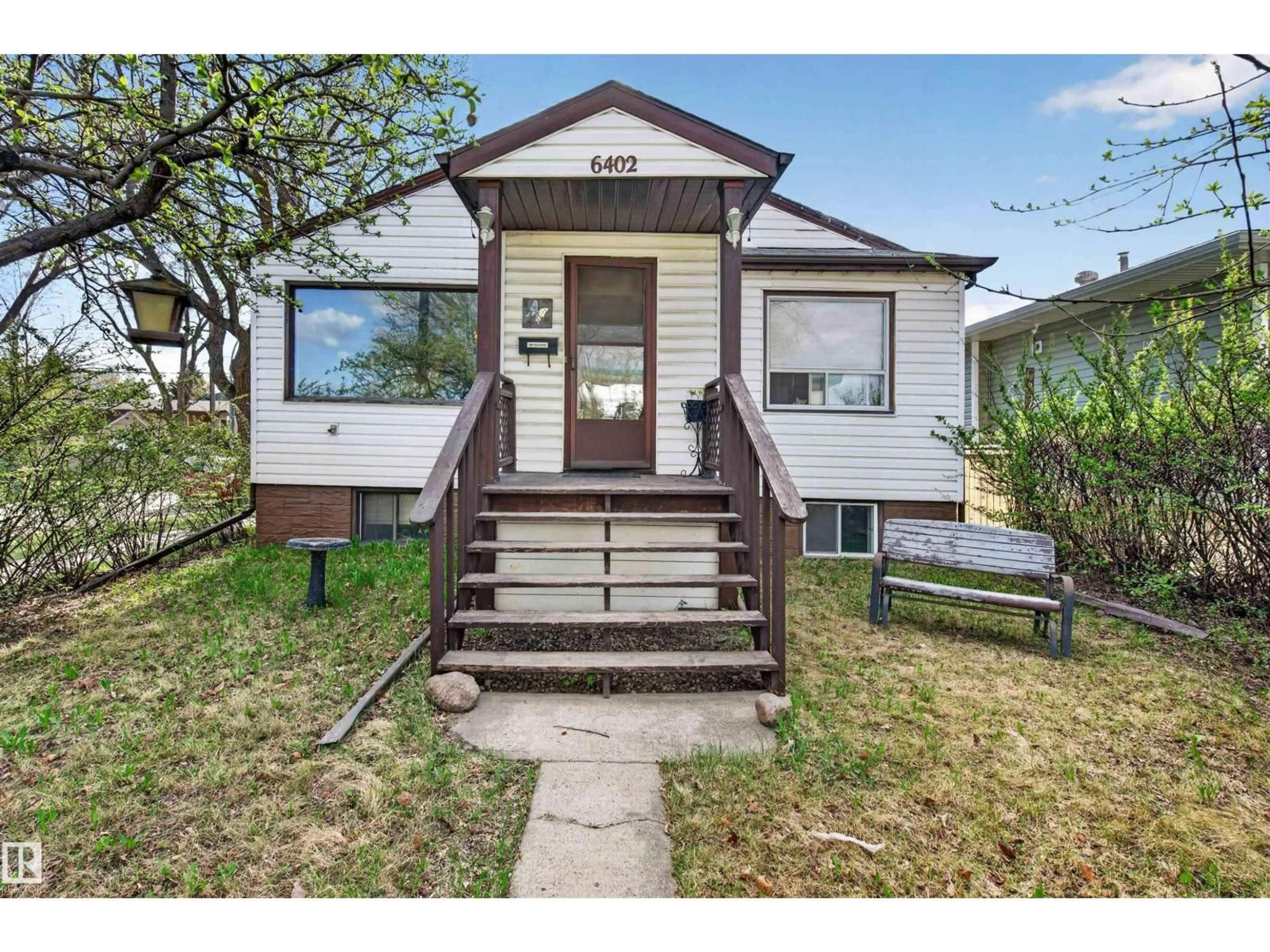 Home with vinyl exterior material, street for 6402 106 ST, Edmonton Alberta T6H2V4