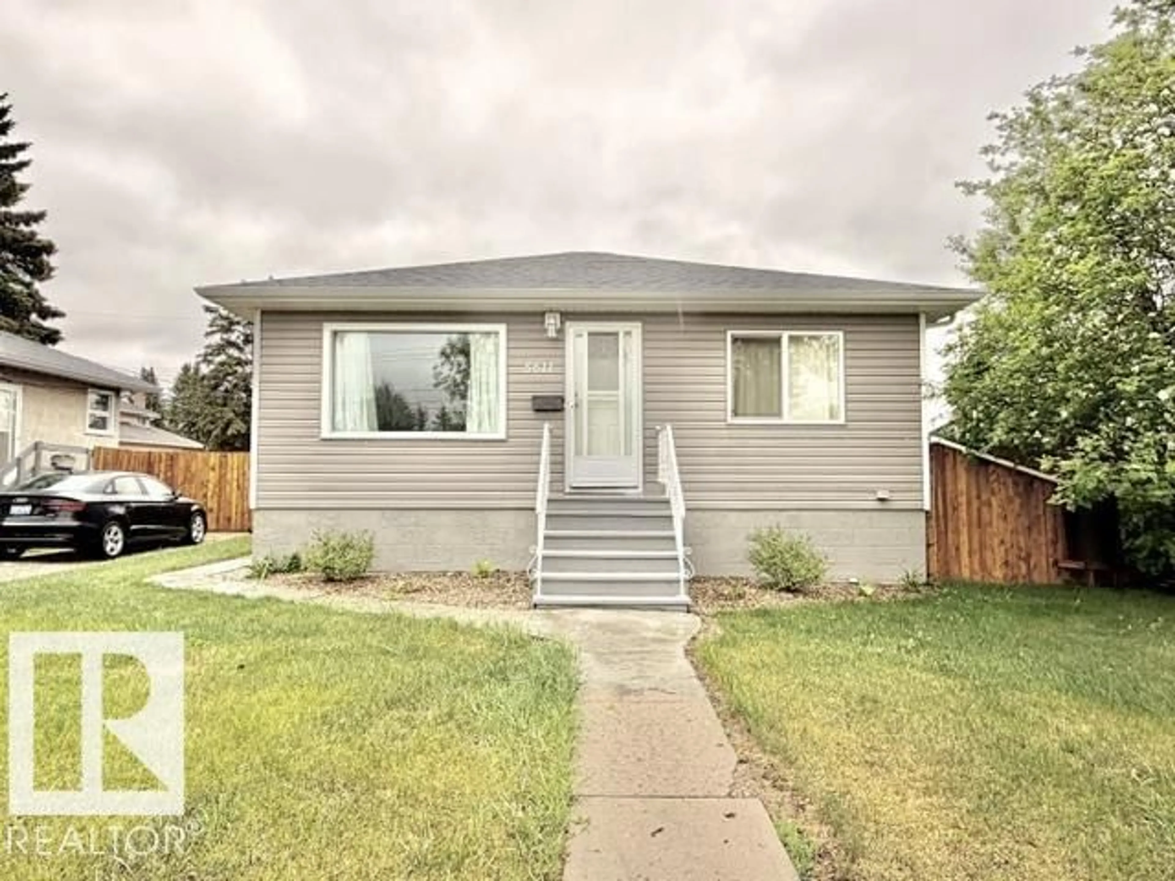 Home with vinyl exterior material, street for 5611 51 AV, Camrose Alberta T4V0W3