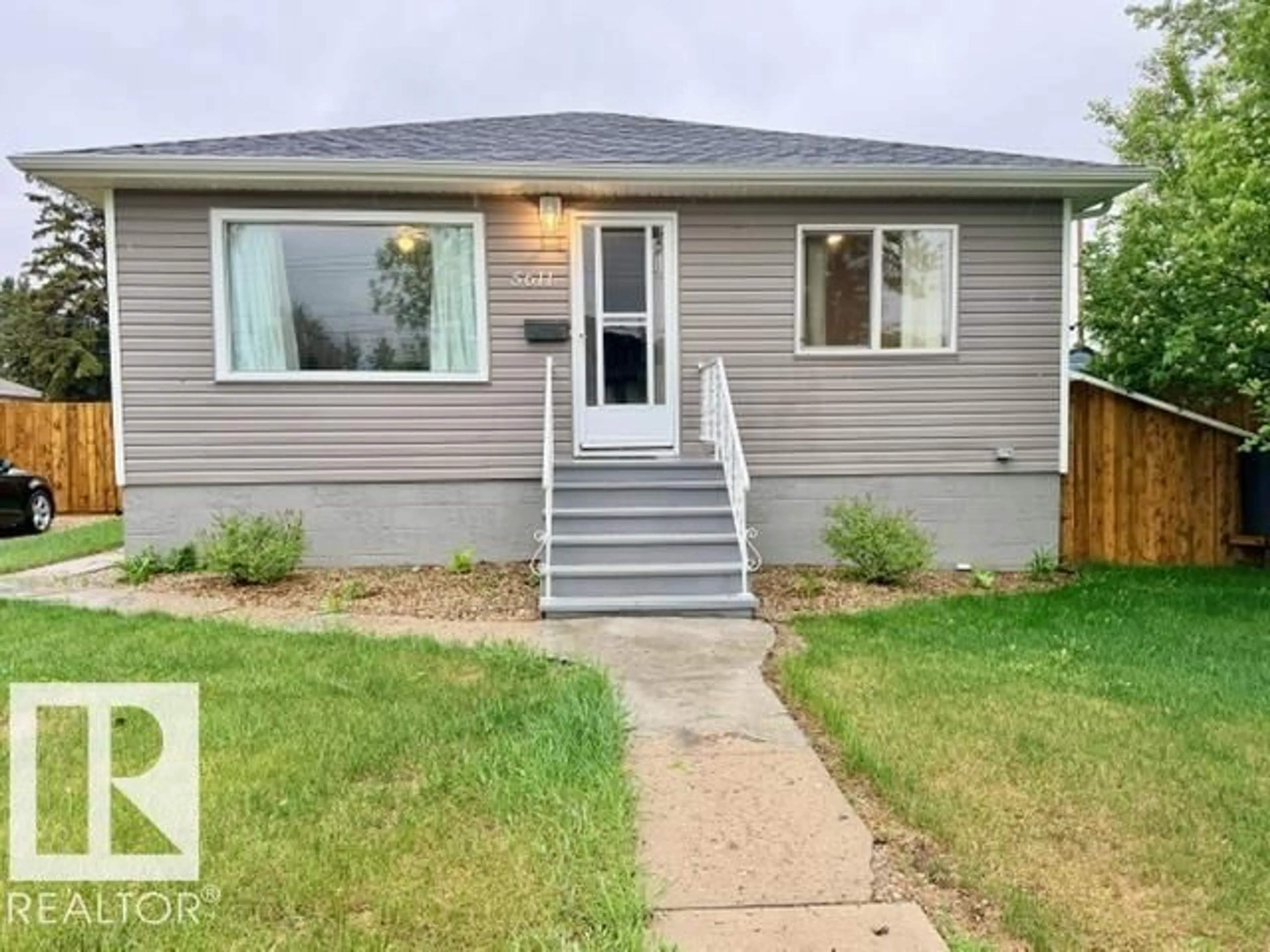 Home with vinyl exterior material, street for 5611 51 AV, Camrose Alberta T4V0W3