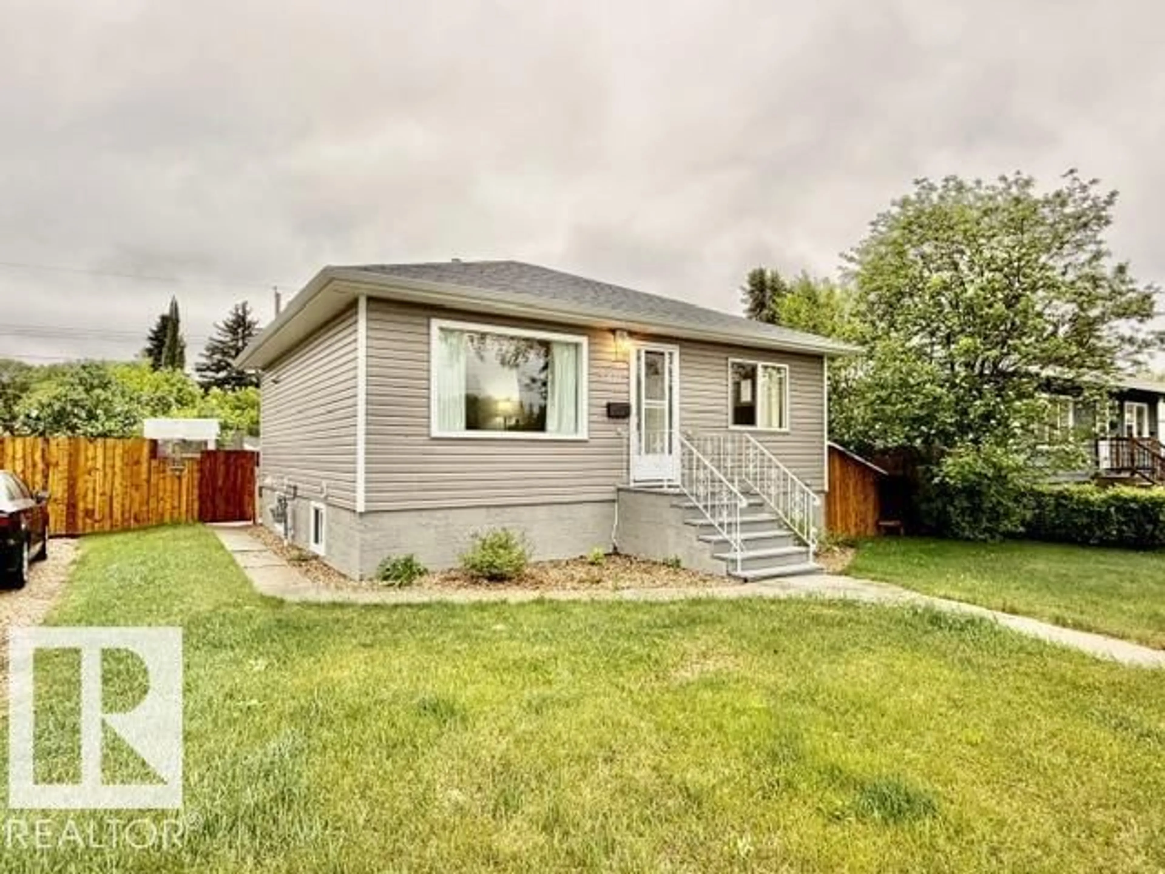 Home with vinyl exterior material, street for 5611 51 AV, Camrose Alberta T4V0W3