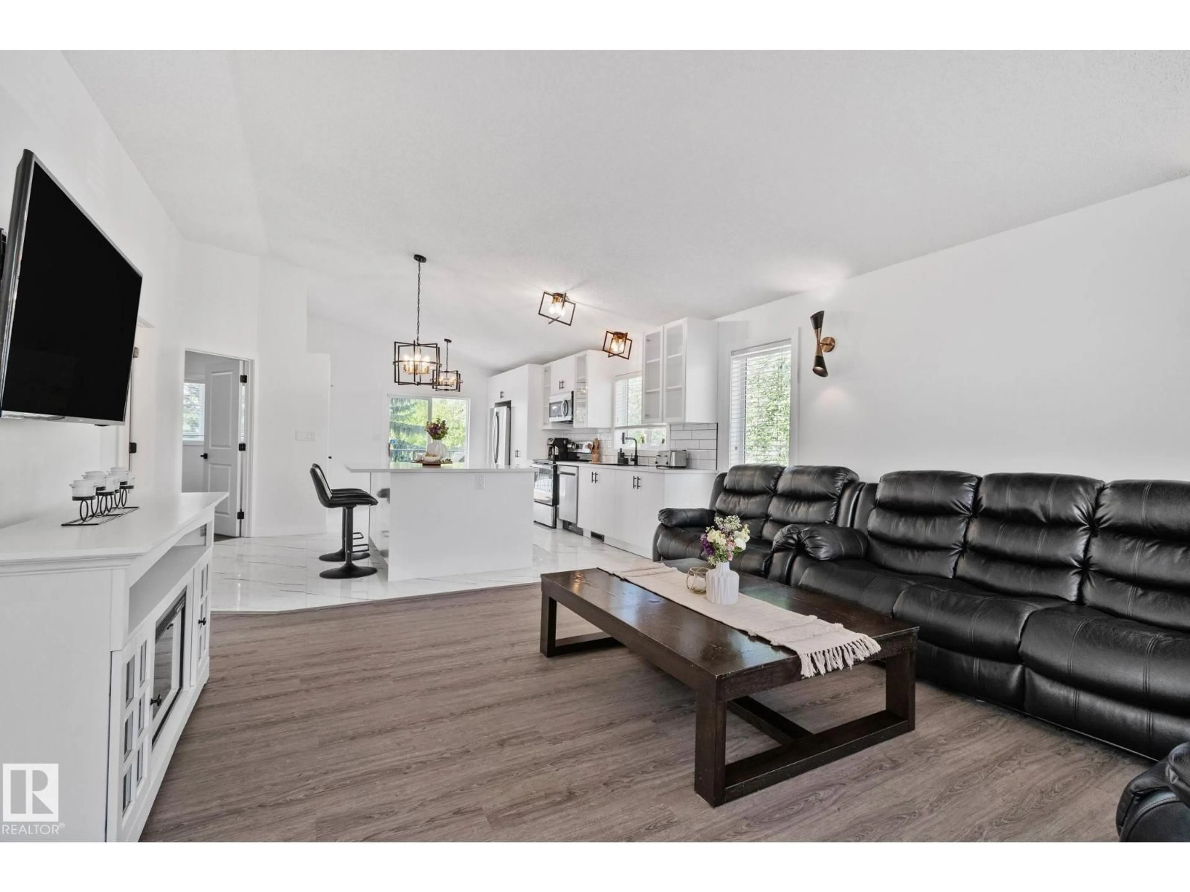 Living room with furniture, wood/laminate floor for 1 HUNT CO, St. Albert Alberta T8N6P8