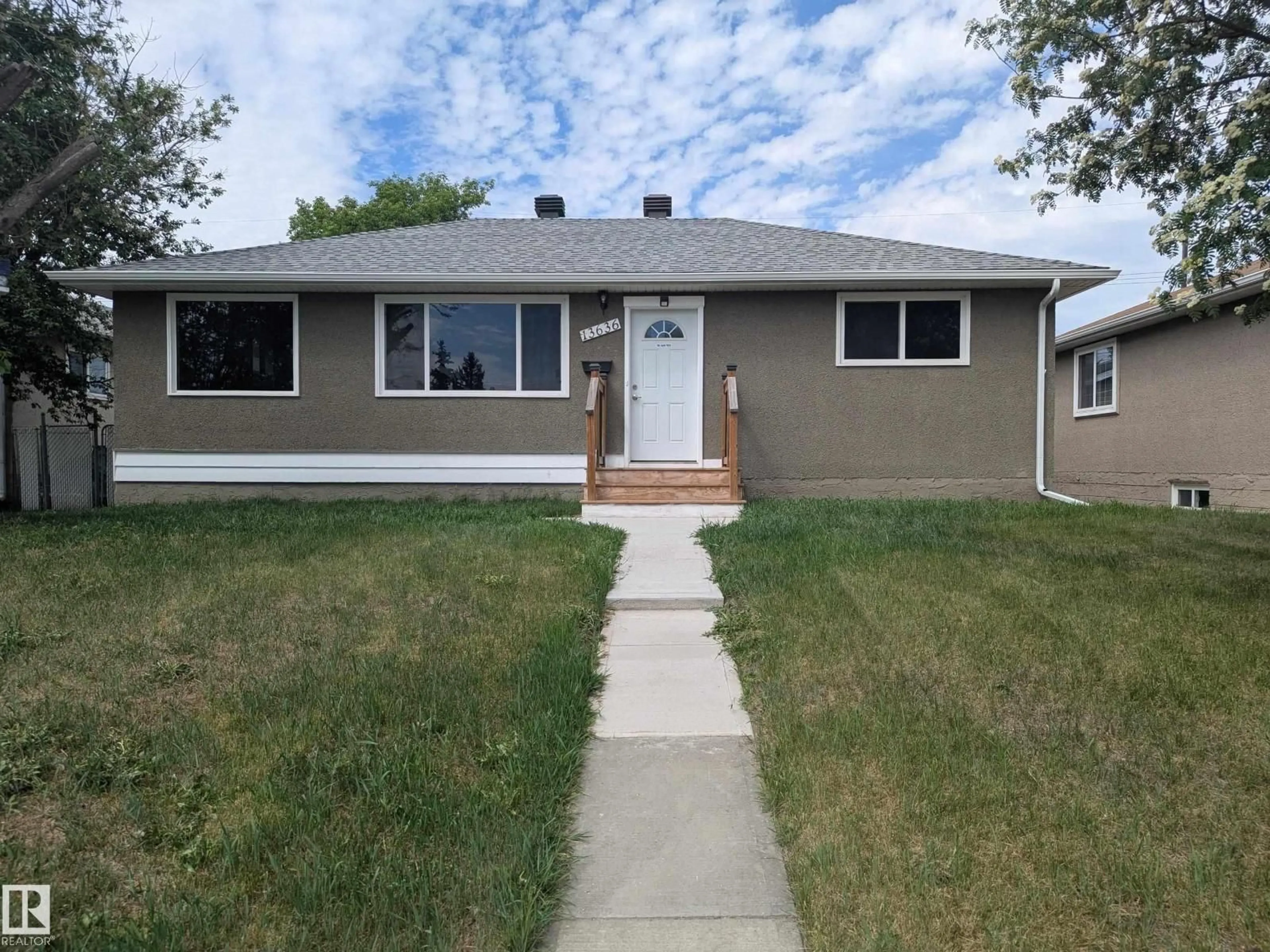 Home with vinyl exterior material, street for 13636 135A AV, Edmonton Alberta T5L3Z9