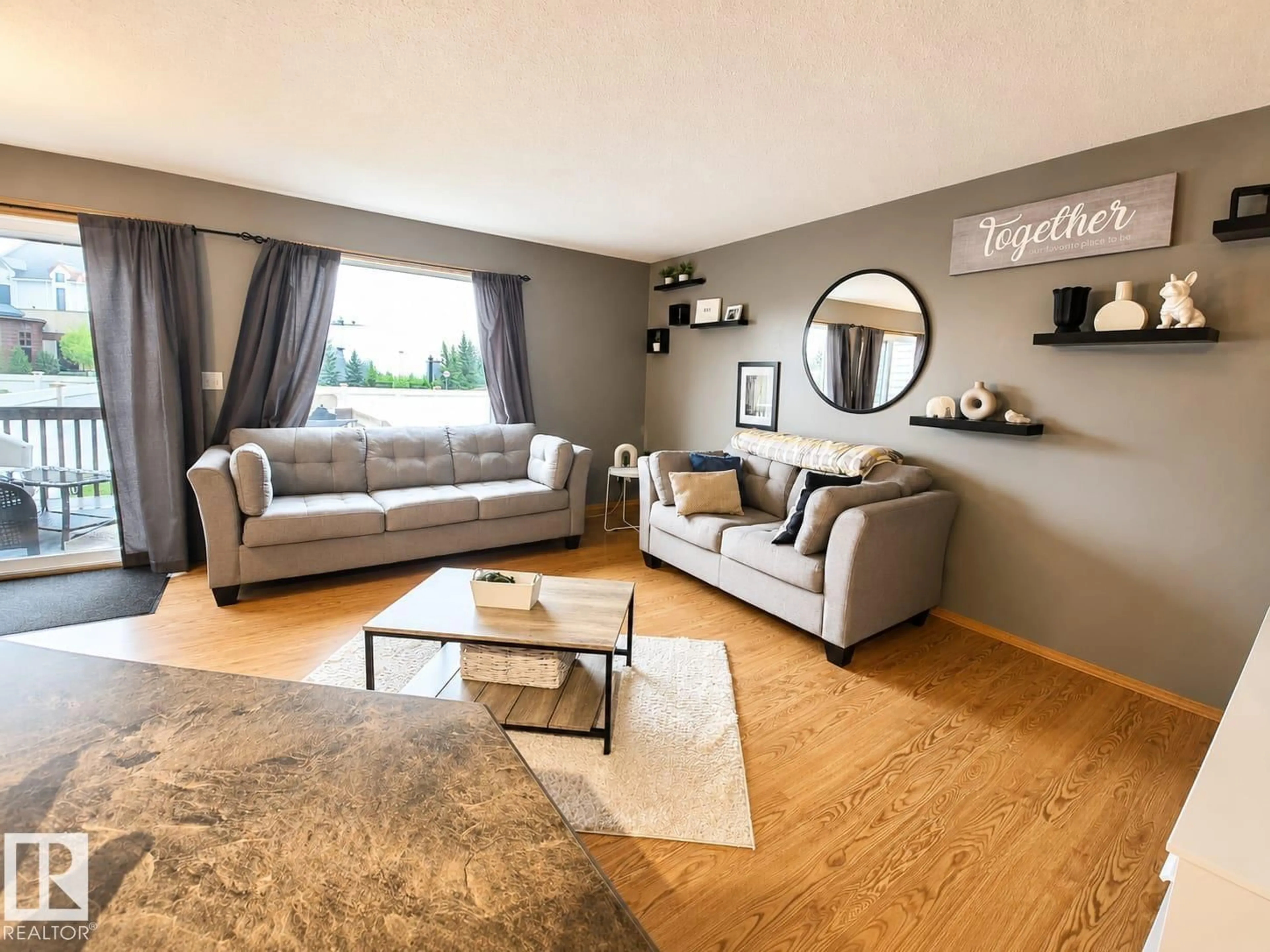 Living room with furniture, wood/laminate floor for ST - 3413 50A CLOSE, Camrose Alberta T4V1J8