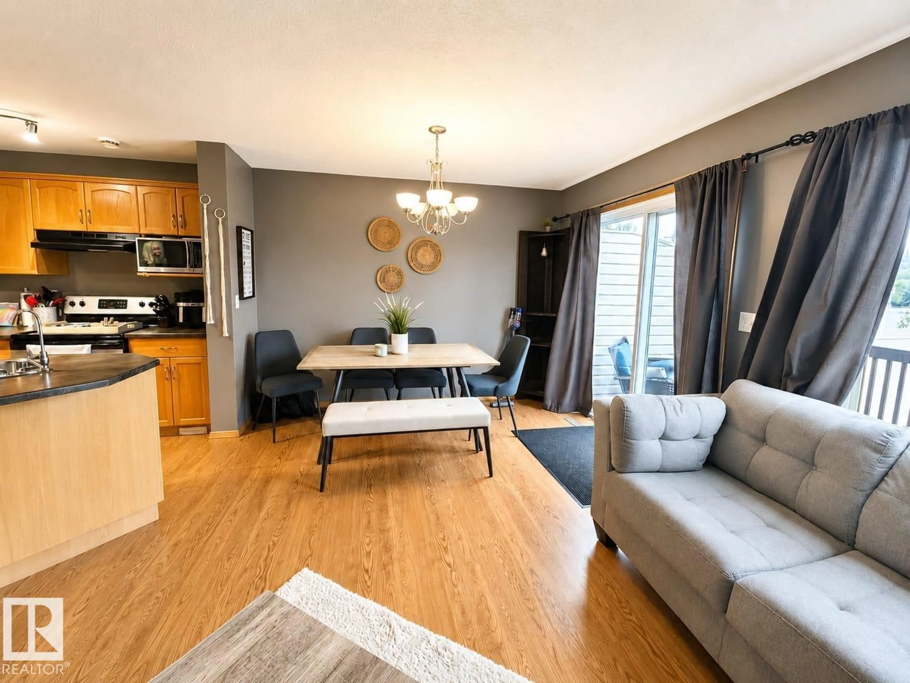 Living room with furniture, wood/laminate floor for ST - 3413 50A CLOSE, Camrose Alberta T4V1J8