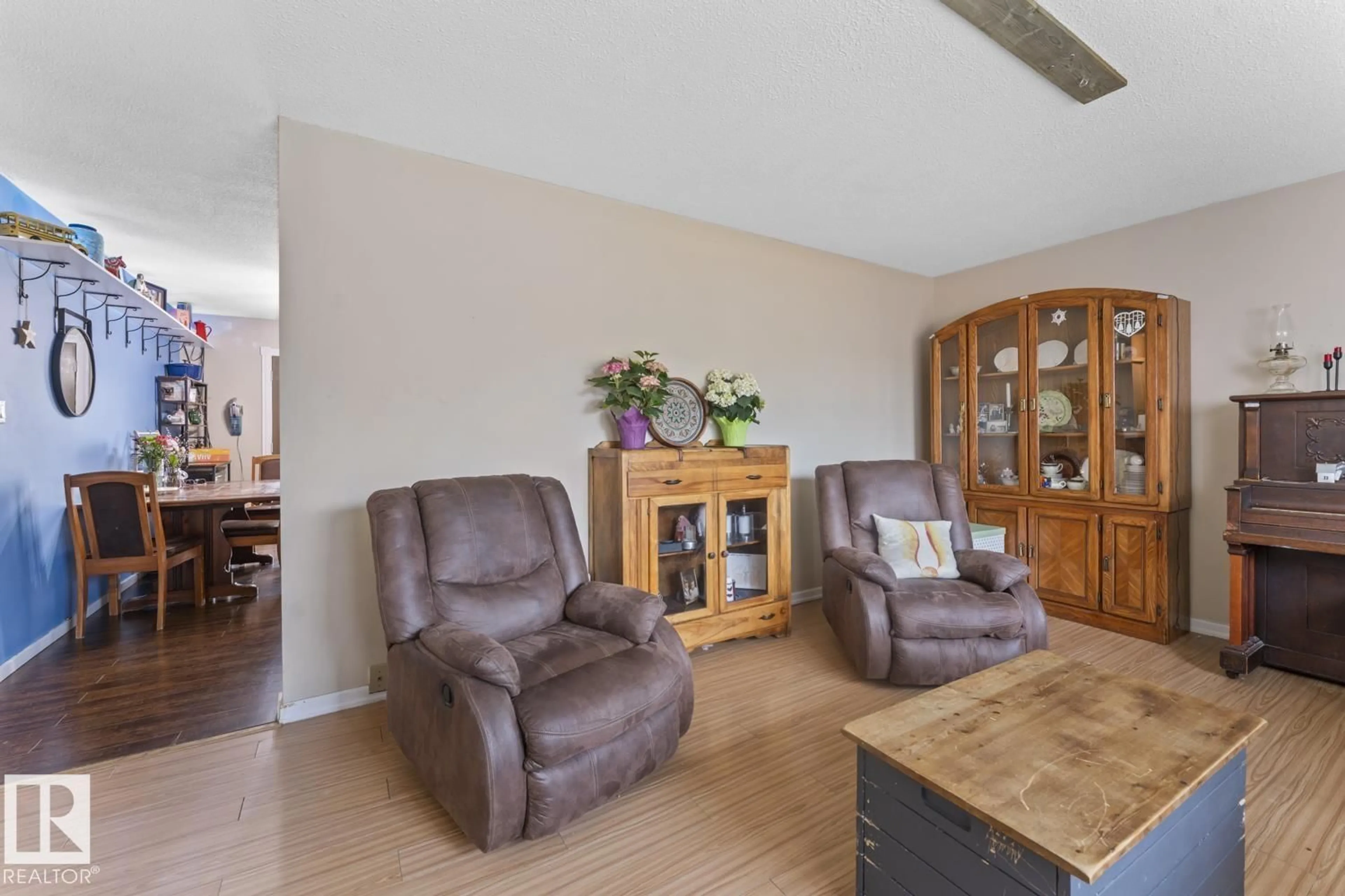 Living room with furniture, wood/laminate floor for 4723 57A ST, Cold Lake Alberta T9M1T9