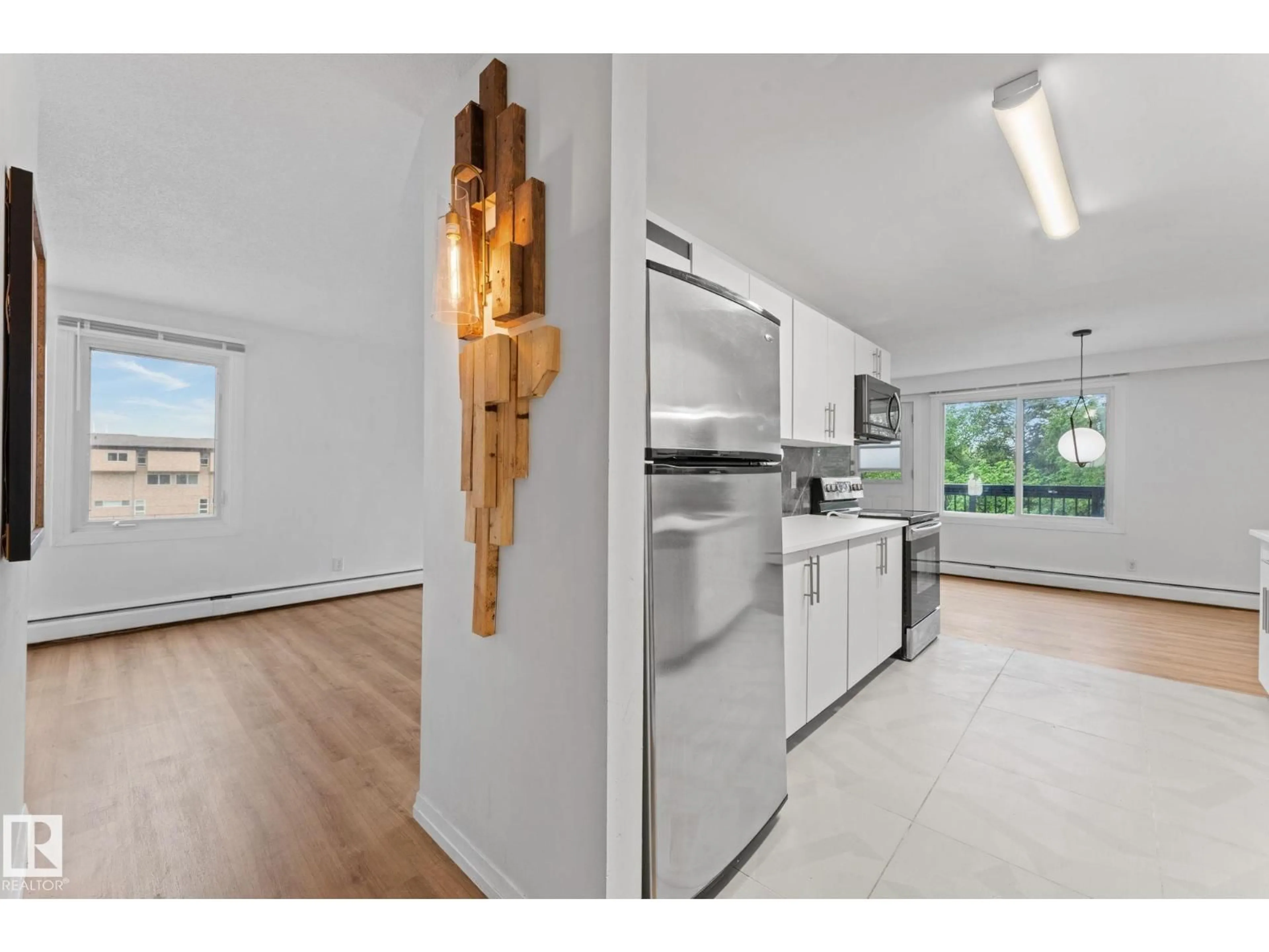 Open concept kitchen, wood/laminate floor for 202 - 7815 159 ST, Edmonton Alberta T5R2E1