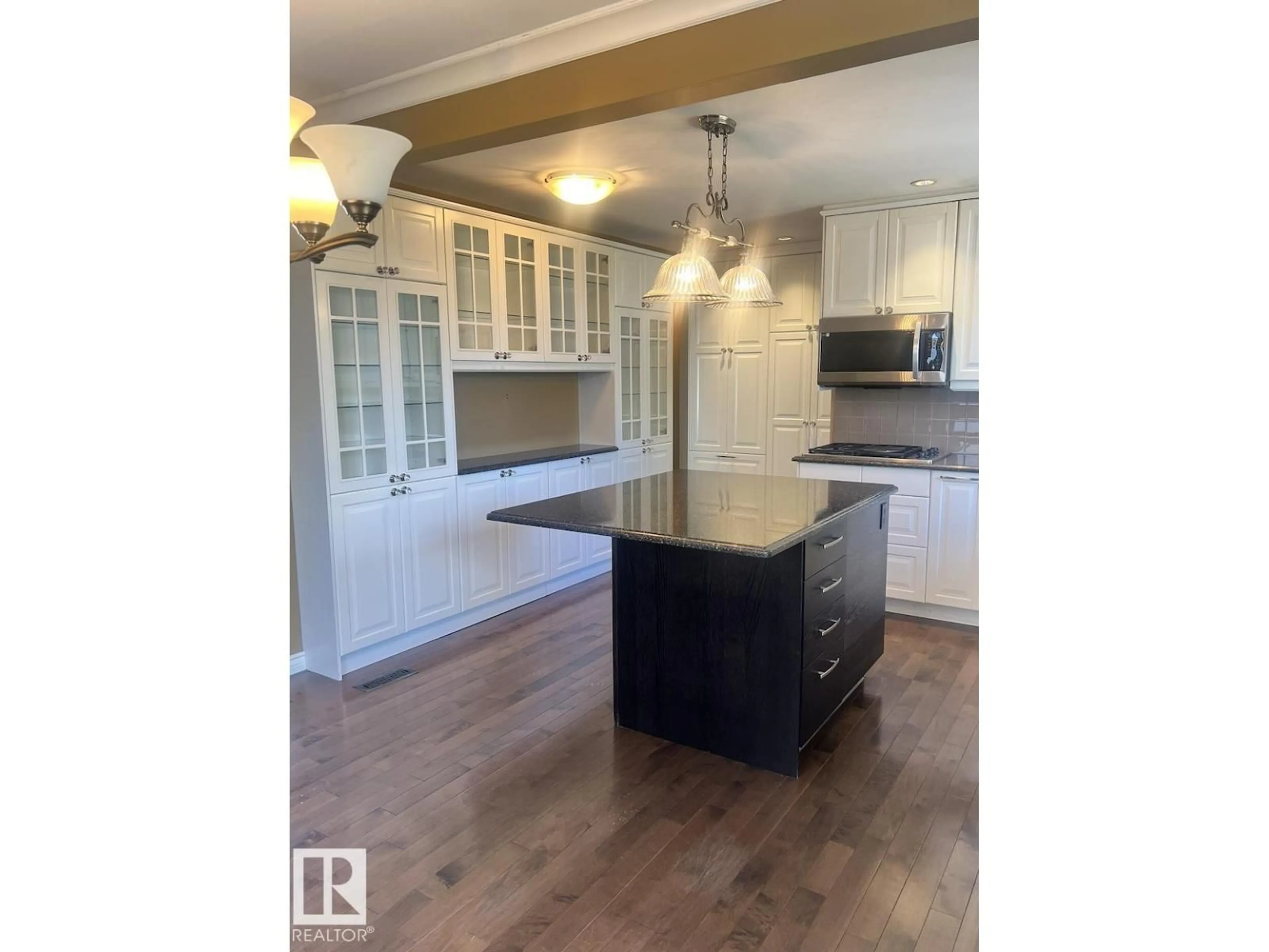 Open concept kitchen, wood/laminate floor for NW - 15003 81 ST, Edmonton Alberta T5C1P4