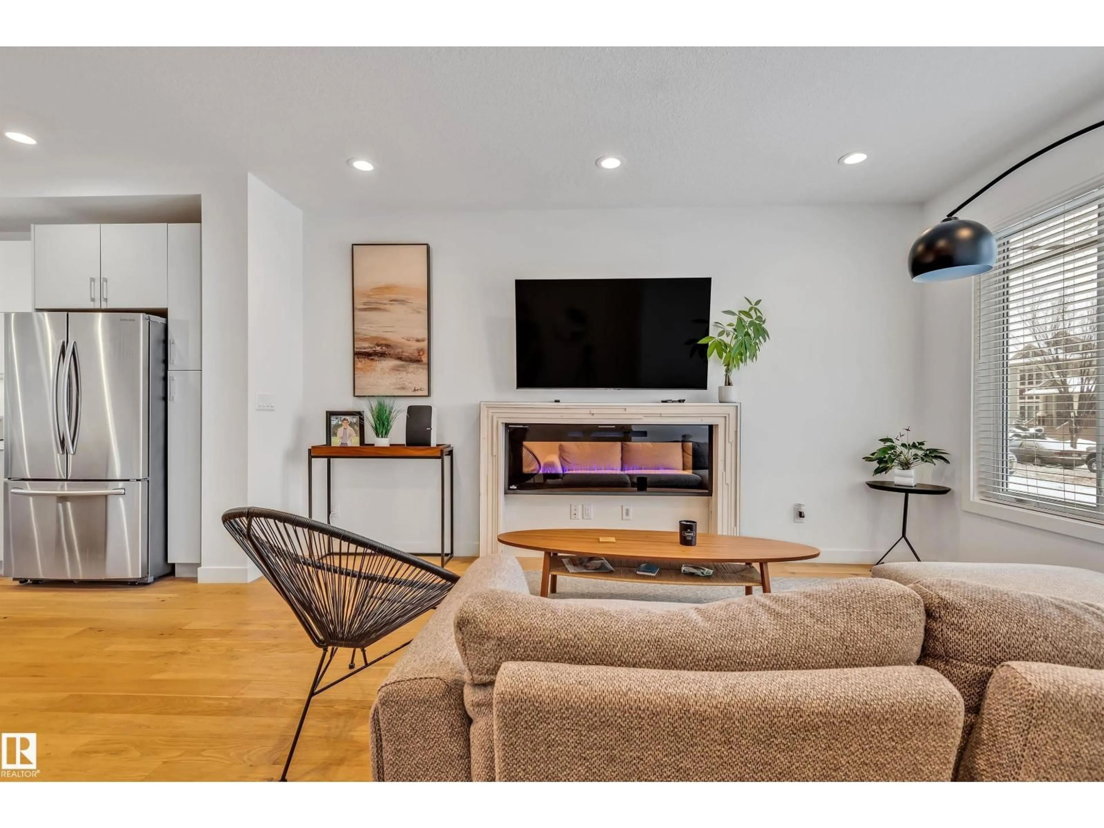 Living room with furniture, wood/laminate floor for 7944 81 AV, Edmonton Alberta T6C0V7