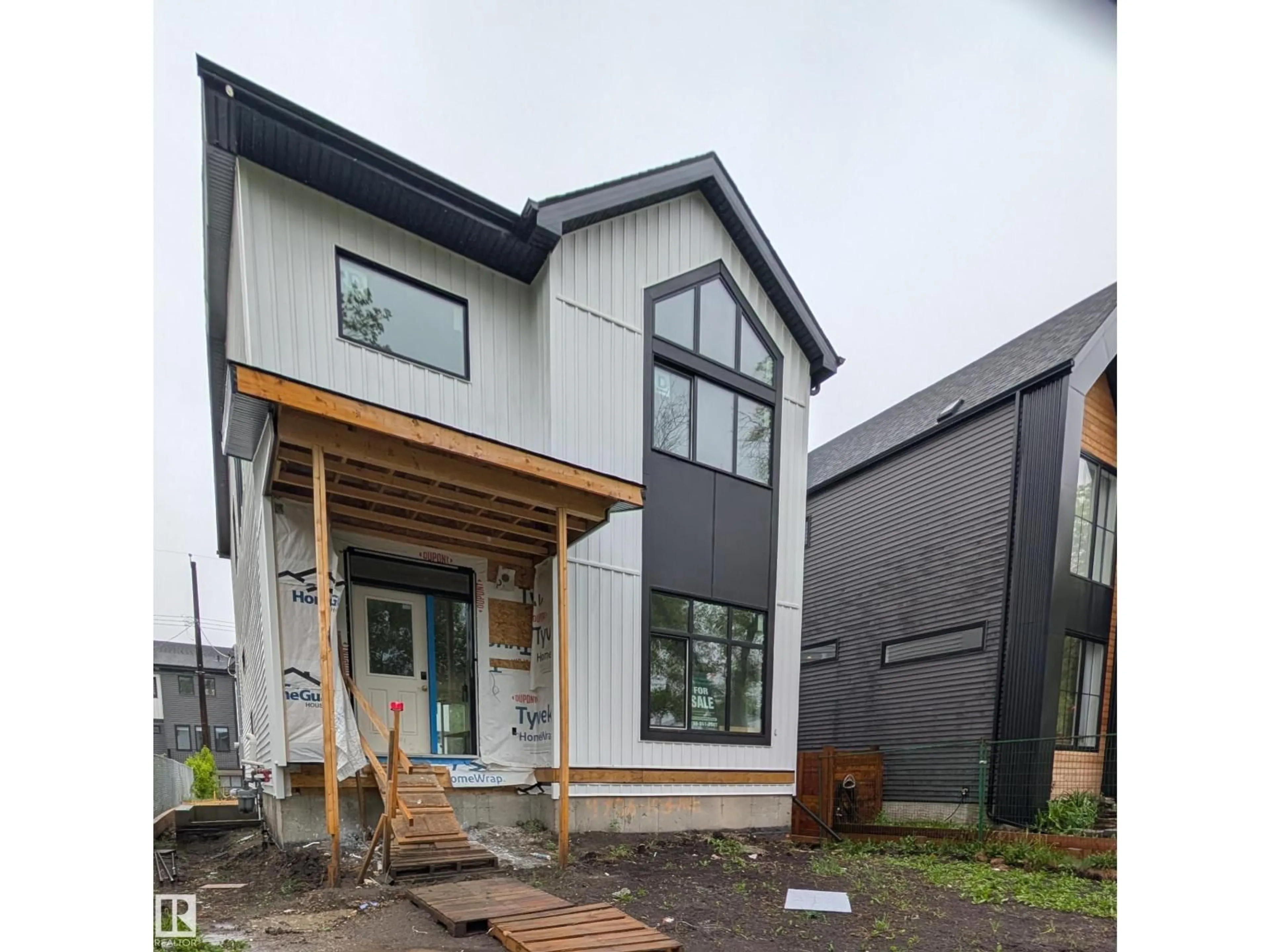 Home with vinyl exterior material, street for 14706 103 AV NW, Edmonton Alberta T5N0T9