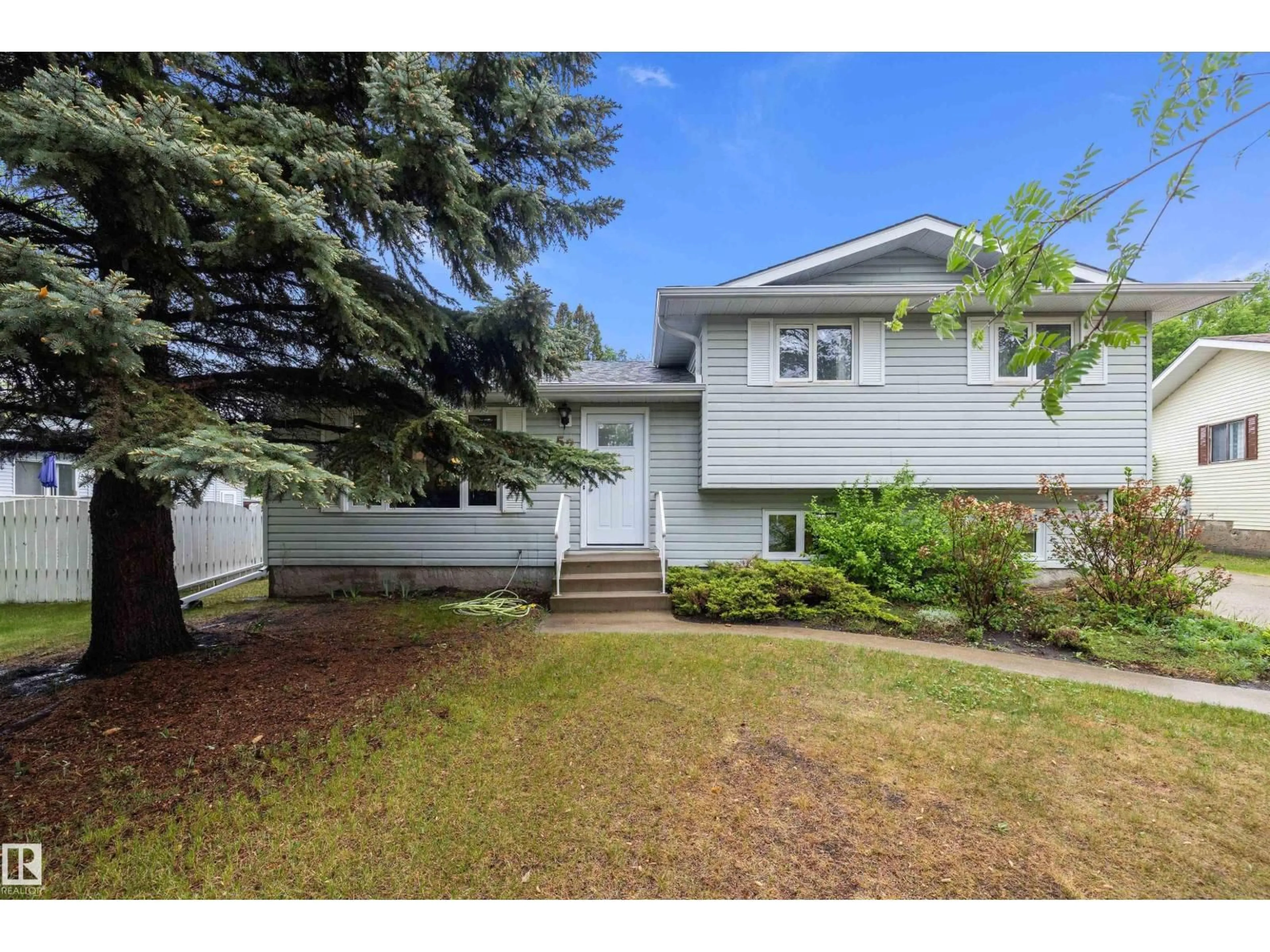 Home with vinyl exterior material, street for 52 ALEXANDER DR, Leduc Alberta T9E5H5