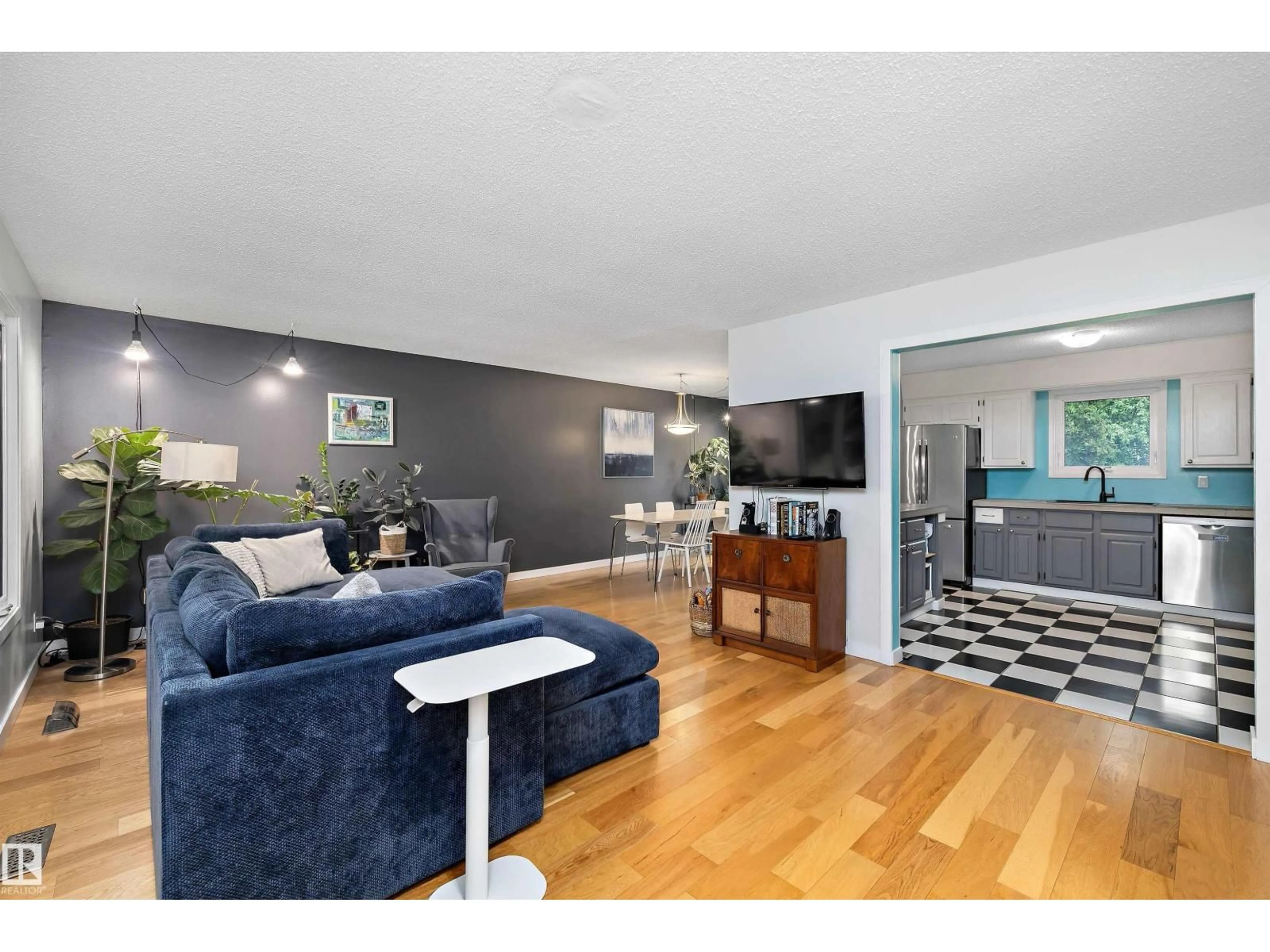 Living room with furniture, wood/laminate floor for 52 ALEXANDER DR, Leduc Alberta T9E5H5