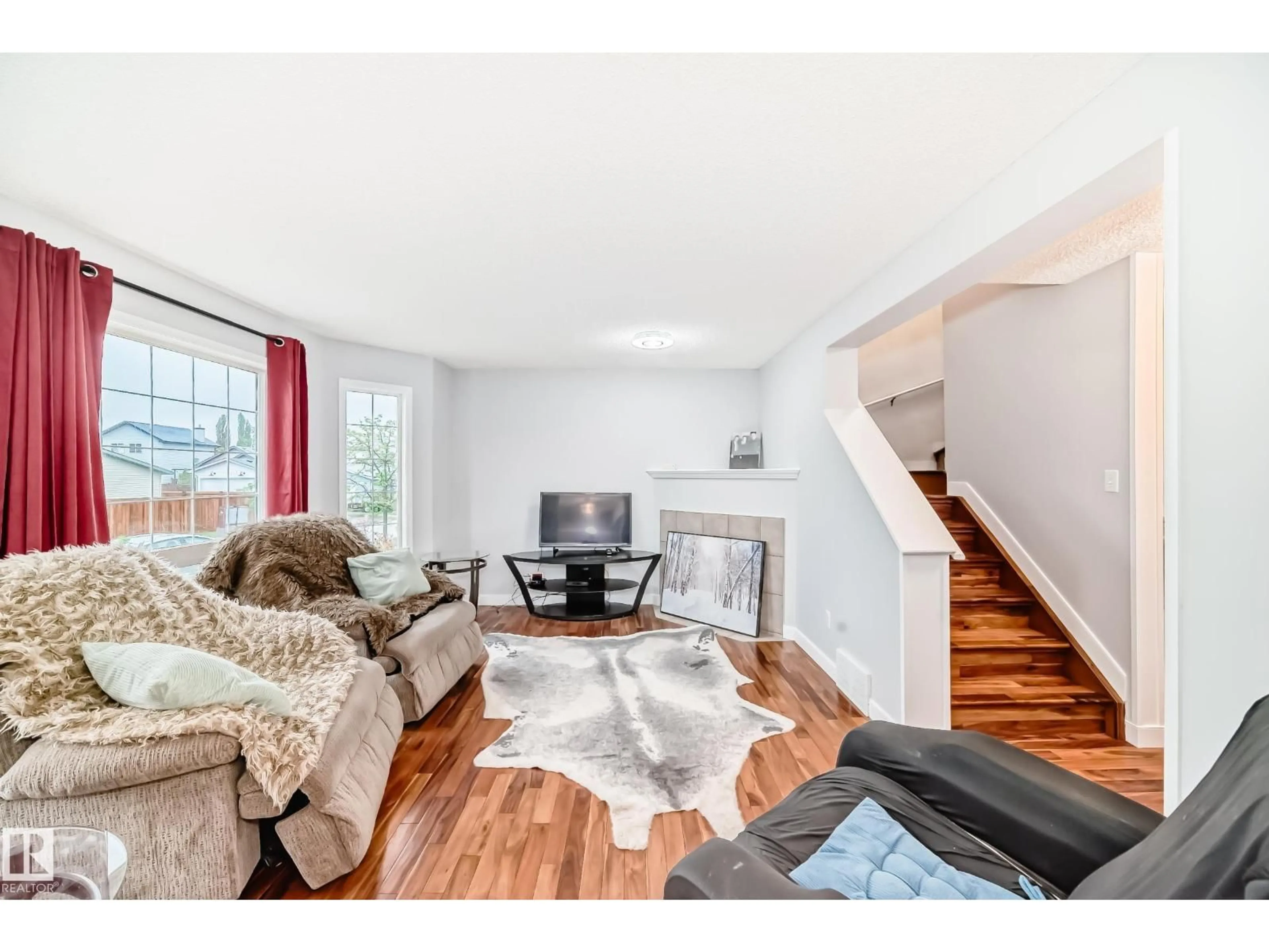 Living room with furniture, wood/laminate floor for 8 CAMPBELL CO, Leduc Alberta T9E8J9